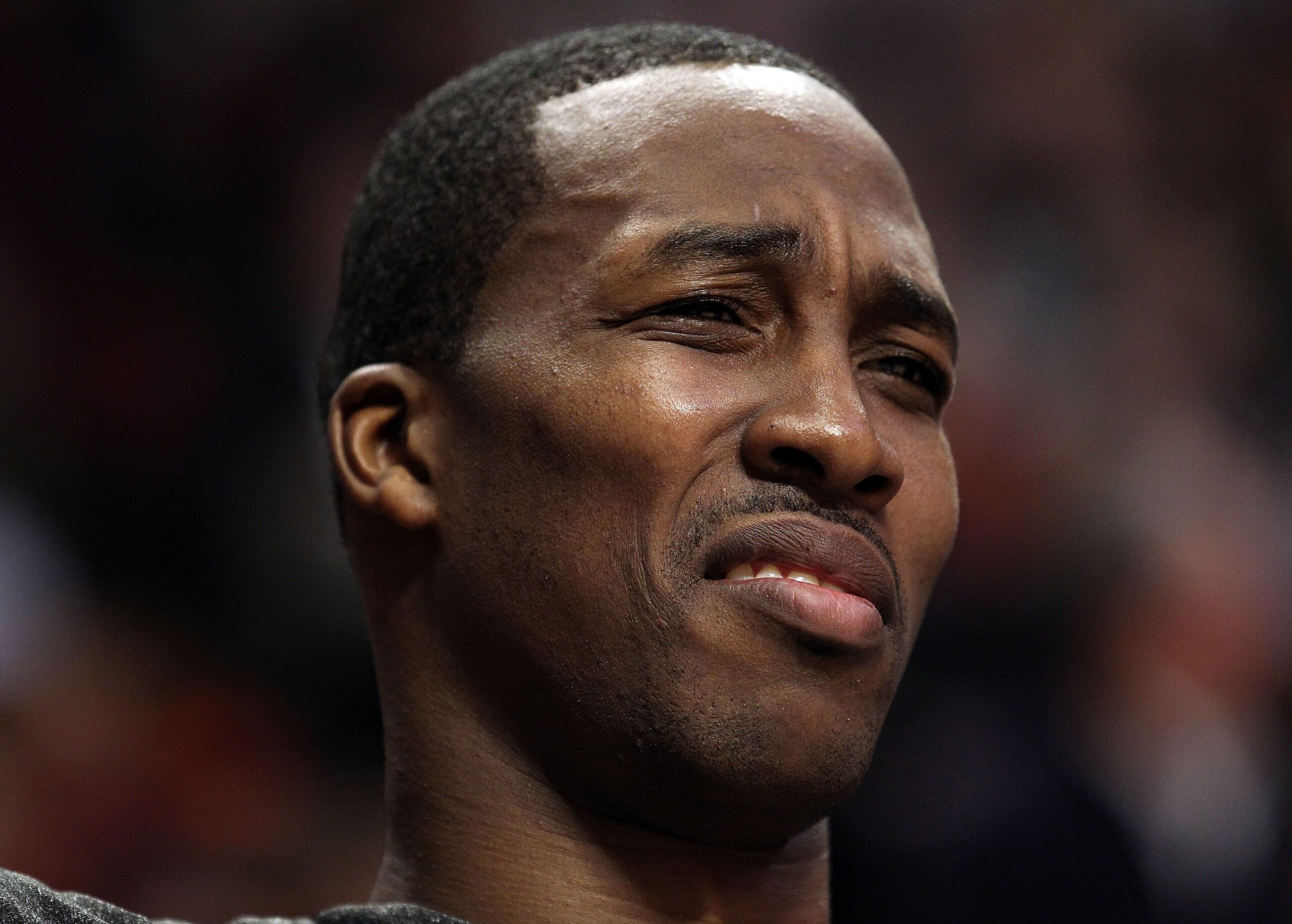 CHICAGO, IL - JANUARY 28: Dwight Howard #12 of the Orlando Magic reacts to the taunts of a fan as he sits on the bench during a game against the Chicago Bulls at the United Center on January 28, 2011 in Chicago, Illinois. NOTE TO USER: User expressly ackn CHICAGO, IL - JANUARY 28: Dwight Howard #12 of the Orlando Magic reacts to the taunts of a fan as he sits on the bench during a game against the Chicago Bulls at the United Center on January 28, 2011 in Chicago, Illinois. NOTE TO USER: User expressly ackn