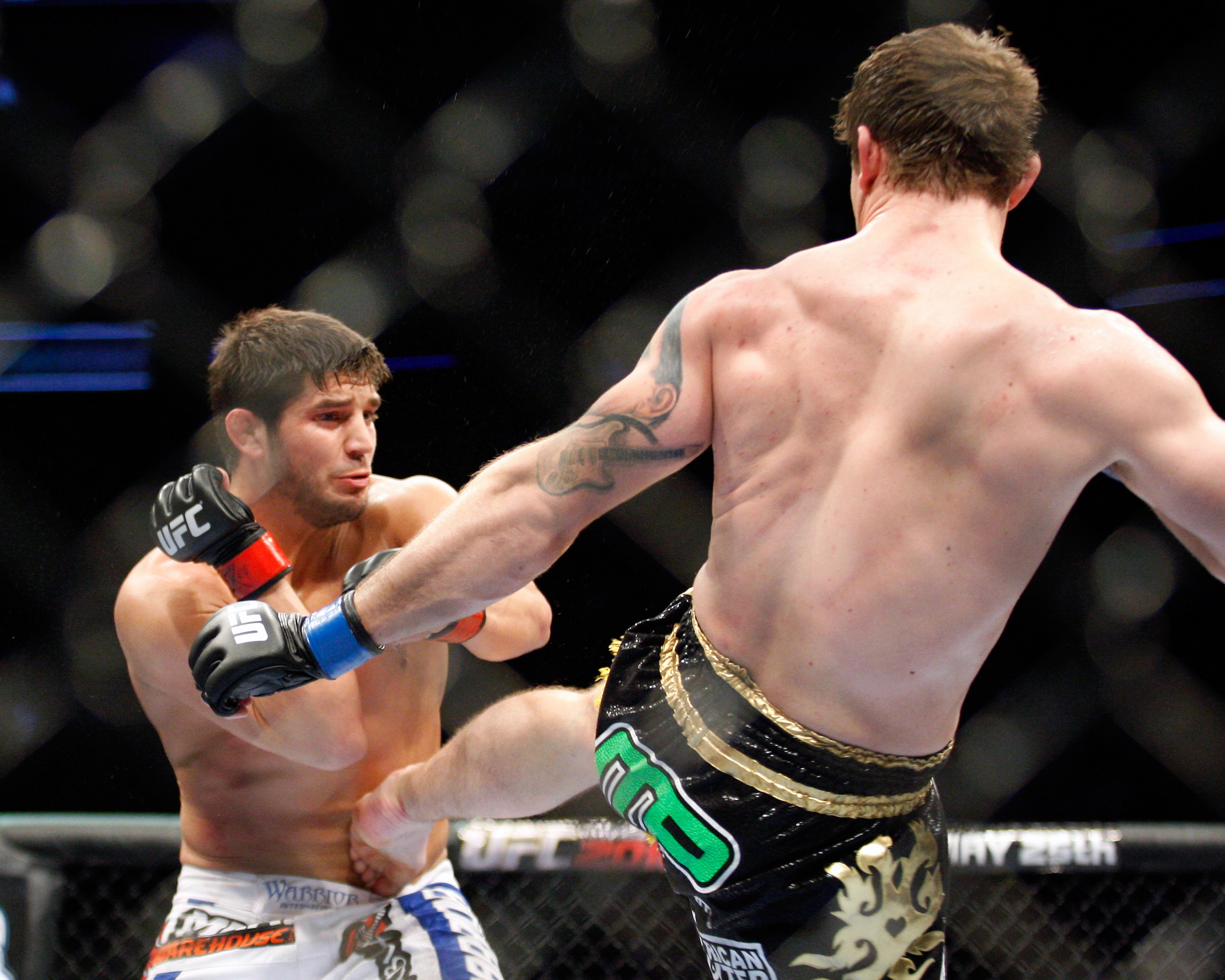 MONTREAL- MAY 8: Alan Belcher (R) kicks Patrick Cote in the stomach in their middleweight bout at UFC 113 at Bell Centre on May 8, 2010 in Montreal, Quebec, Canada.  (Photo by Richard Wolowicz/Getty Images)