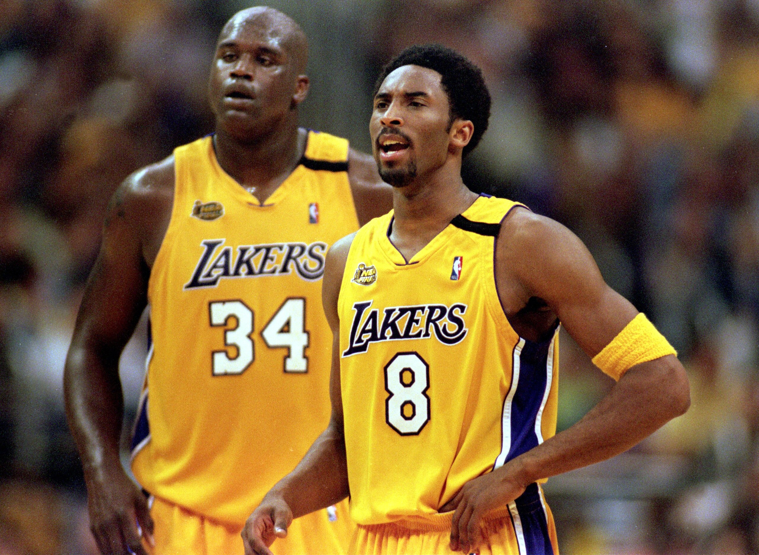 19 Jun 2000:  Kobe Bryant #8 and Shaquille O''Neal #34 of the Los Angeles Lakers looking on during the NBA Finals Game 6 against the Indiana Pacers at the Staples Center in Los Angeles, California.  The Lakers defeated the Pacers in 116-111.  NOTE TO USER