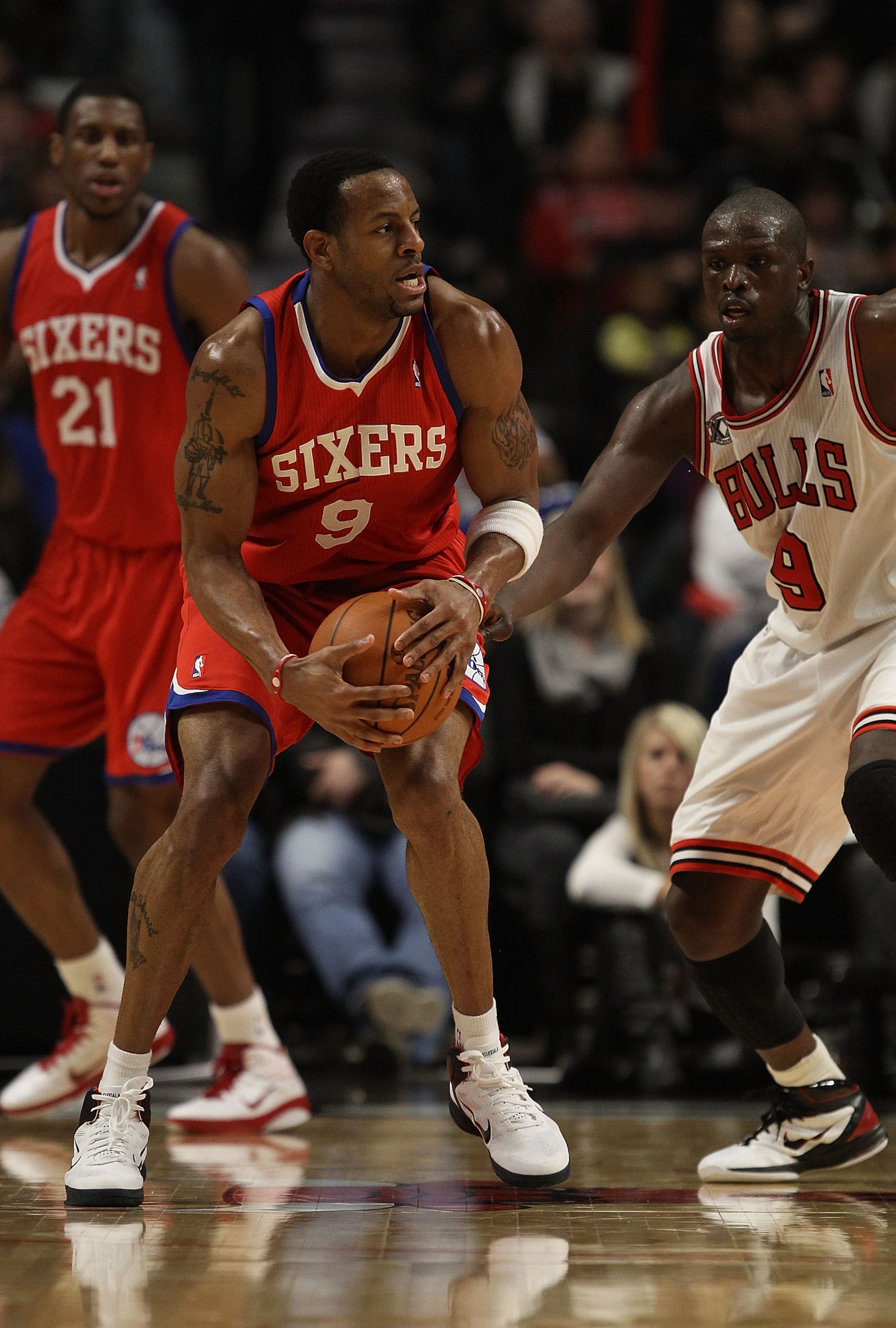 CHICAGO, IL - DECEMBER 21: Andre Iguodala #9 of the Philadelphia 76ers tries to move against Loul Deng #9 of the Chicago Bulls at the United Center on December 21, 2010 in Chicago, Illinois. The Bulls defeated the 76ers 121-76. NOTE TO USER: User expressl