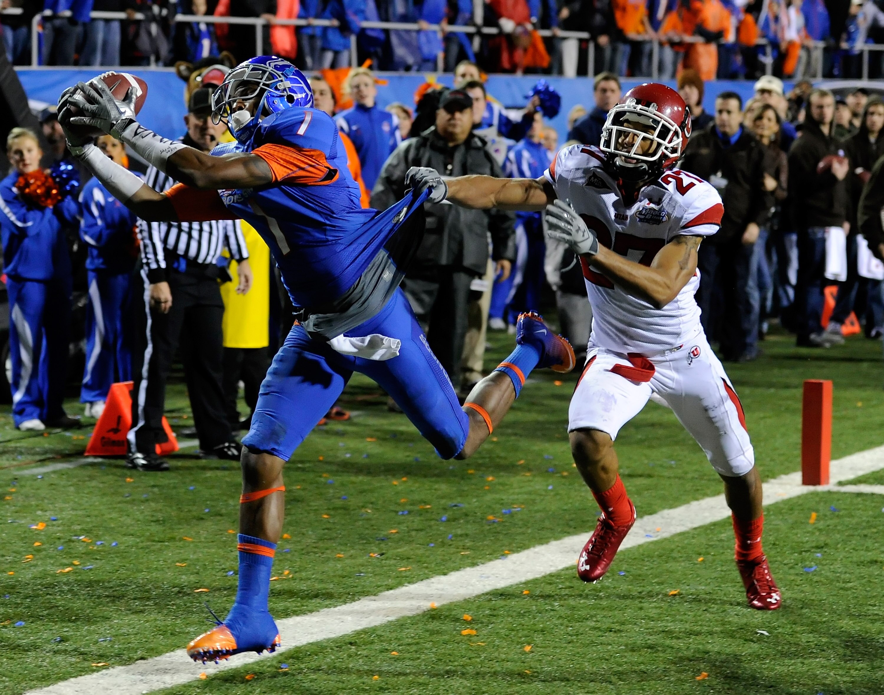 LAS VEGAS, NV - DECEMBER 22:  Titus Young #1 of the Boise State Broncos catches a pass just out of bounds in the end zone in front of Brandon Burton #27 of the Utah Utes during the MAACO Bowl Las Vegas at Sam Boyd Stadium December 22, 2010 in Las Vegas, N