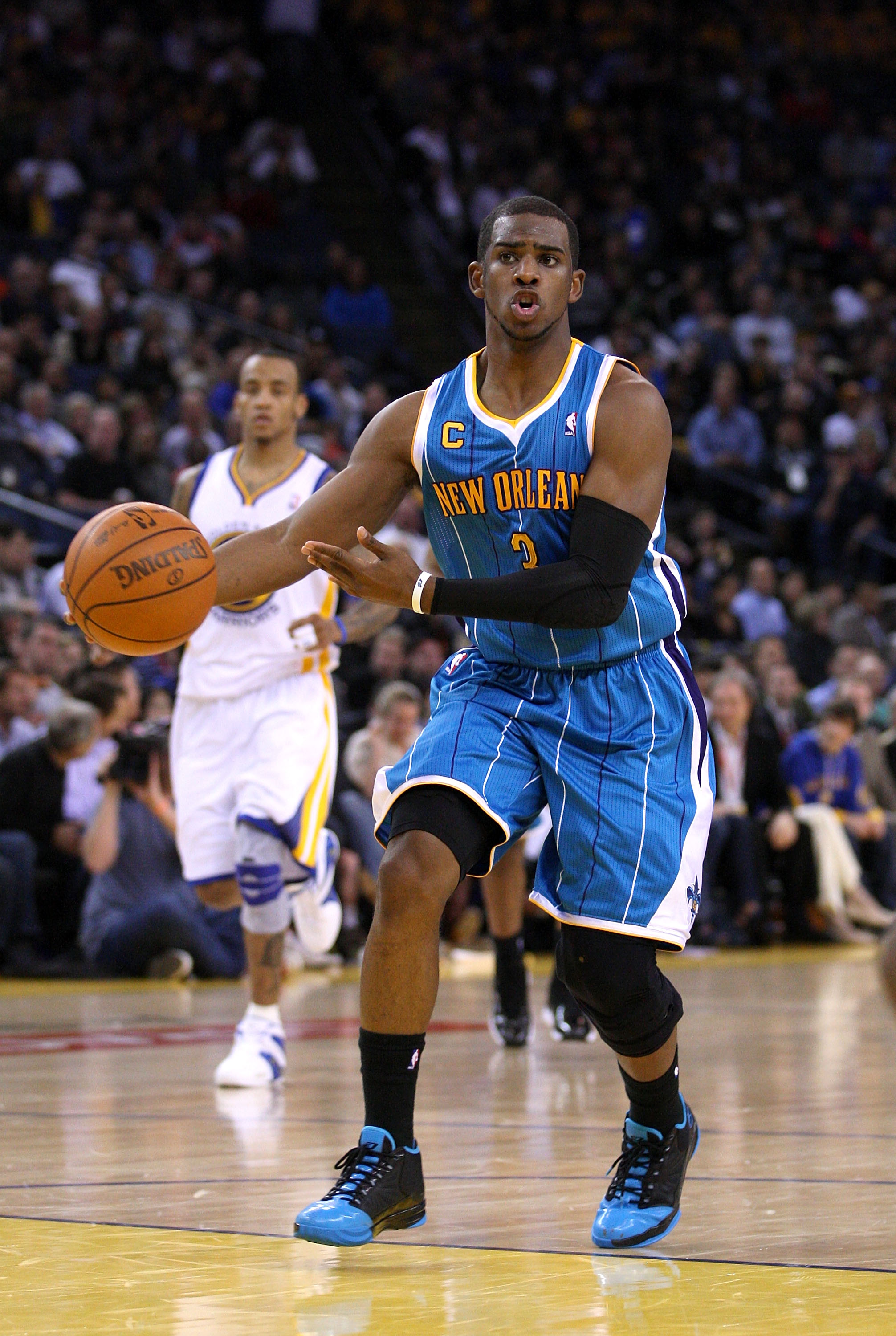 OAKLAND, CA - JANUARY 26:  Chris Paul #3 of the New Orleans Hornets passes the ball during their game against the Golden State Warriors at Oracle Arena on January 26, 2011 in Oakland, California.  NOTE TO USER: User expressly acknowledges and agrees that,