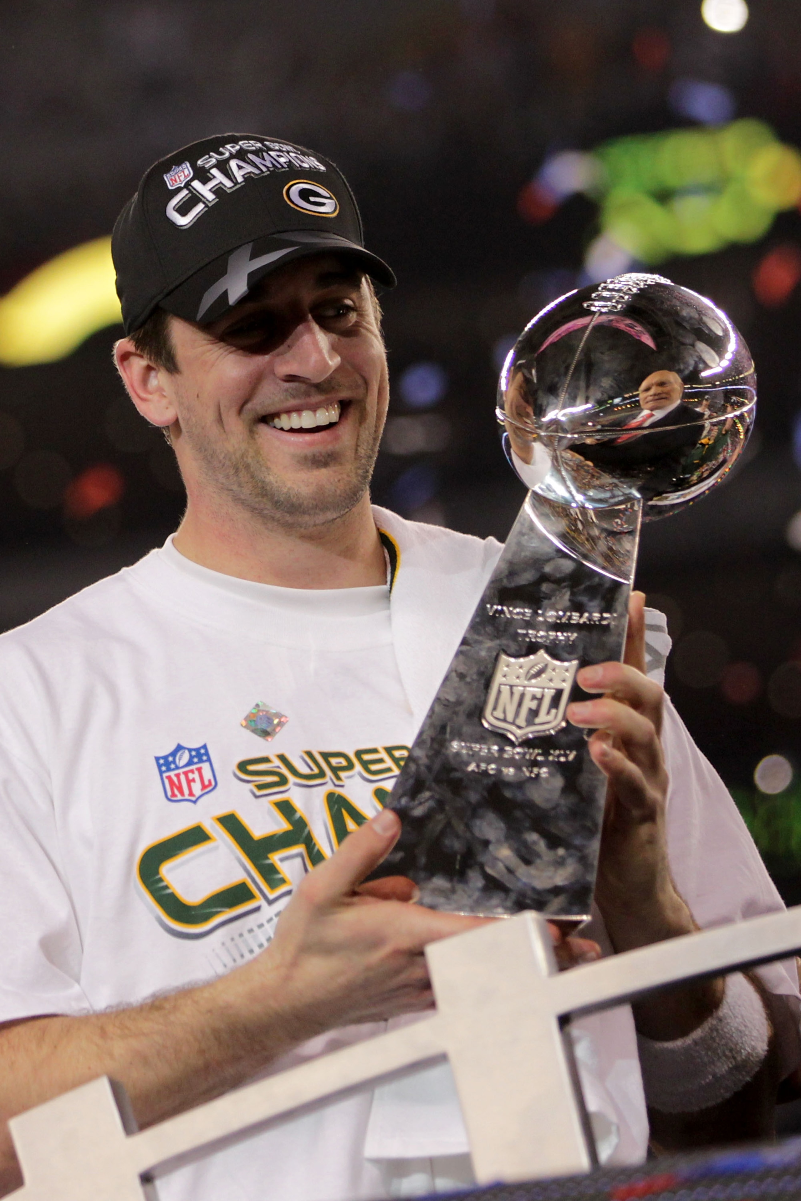 ARLINGTON, TX - FEBRUARY 06:  MVP Aaron Rodgers #12 of the Green Bay Packers holds up The Vince Lombardi Trophy after the Green Bay Packers defeated the Pittsburgh Steelers 31 to 25 in Super Bowl XLV at Cowboys Stadium on February 6, 2011 in Arlington, Te