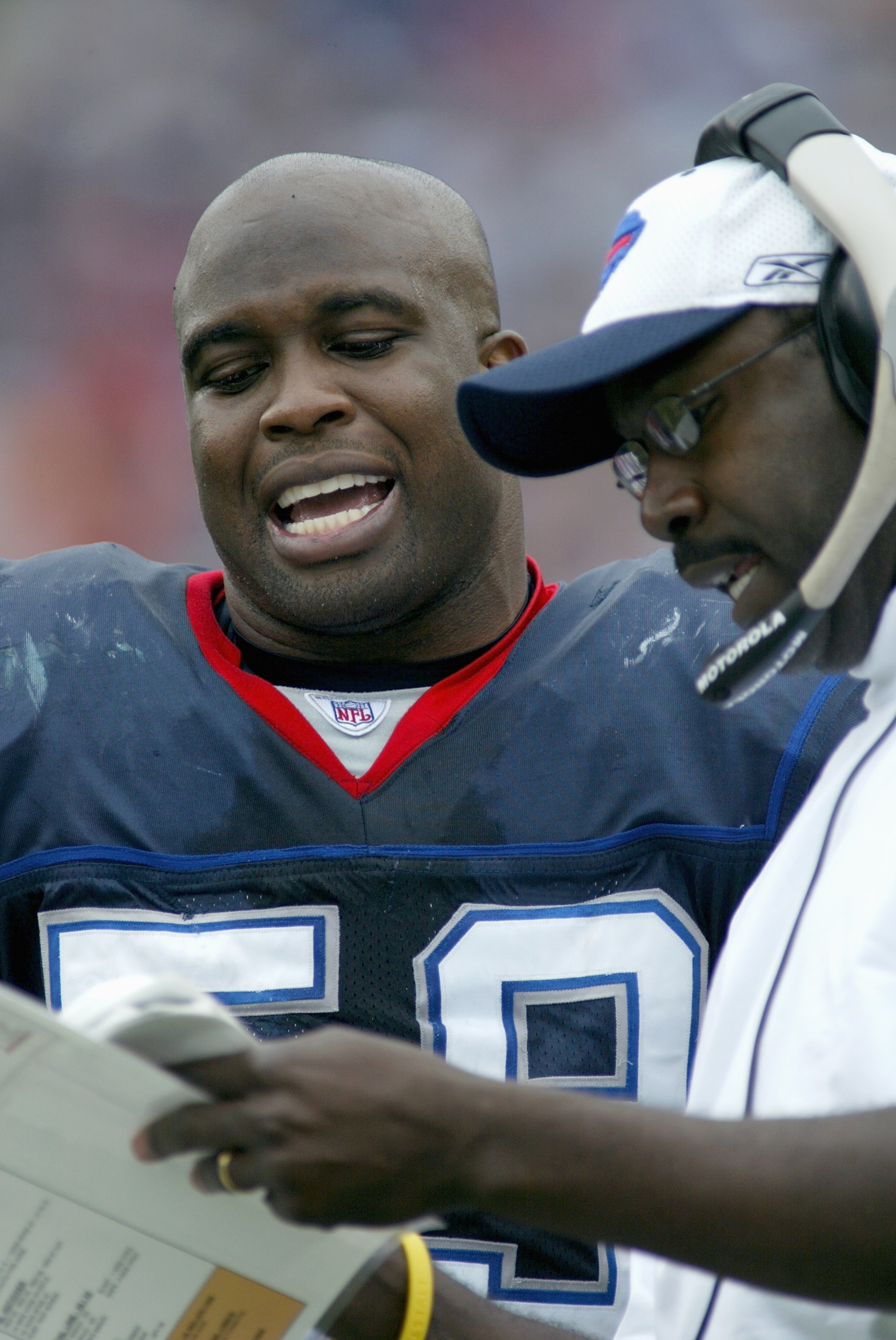 ORCHARD PARK, NY - OCTOBER 9:  London Fletcher #59 talks with defensive coordinator Jerry Gray of the Buffalo Bills makes a catch during the game with the Miami Dolphins on October 9, 2005 at Ralph Wilson Stadium in Orchard Park, New York. The bills won 2