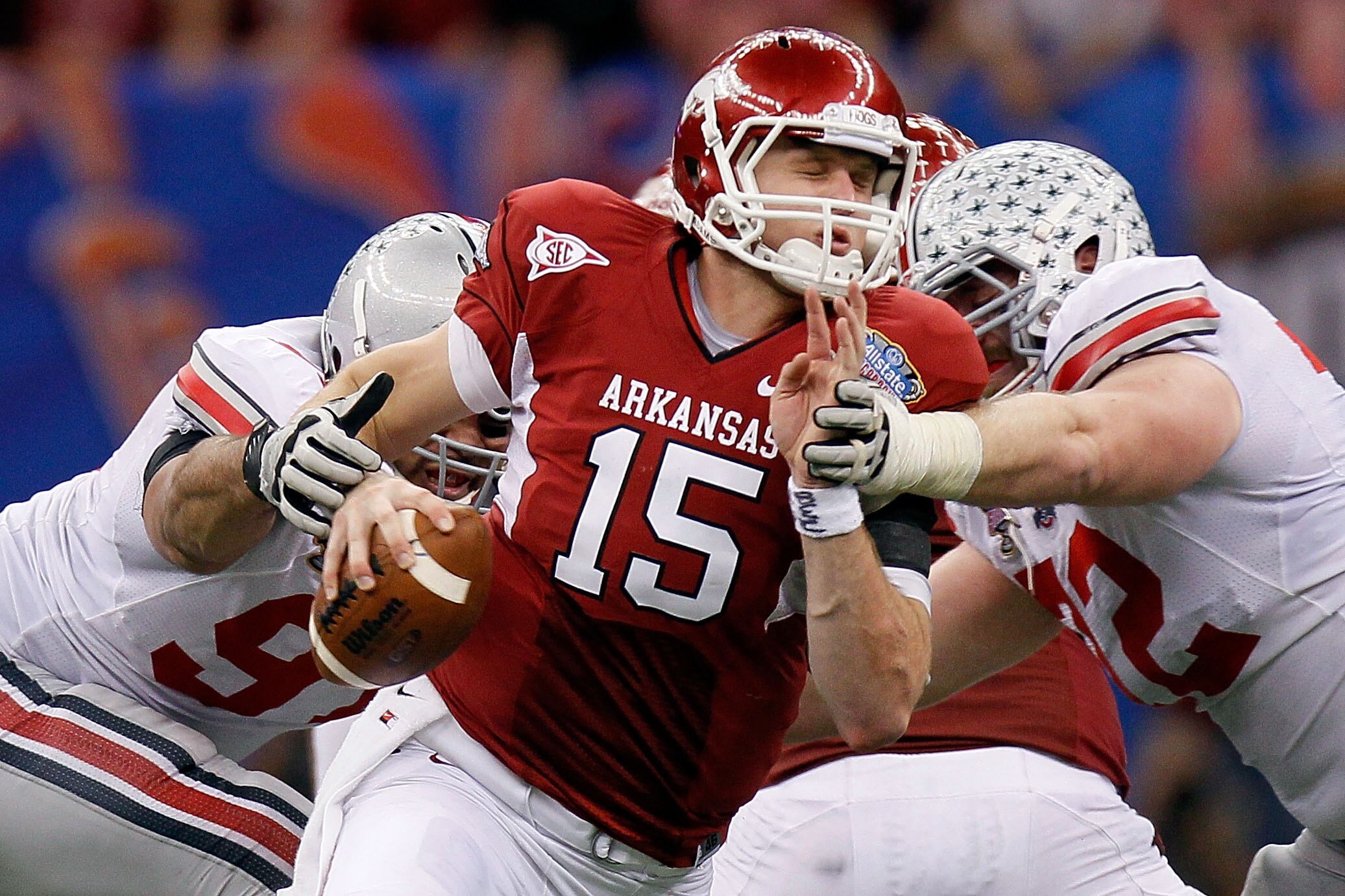 NEW ORLEANS, LA - JANUARY 04:  Quarterback Ryan Mallett #15 of the Arkansas Razorbacks is sacked by Cameron Heyward #97 and Dexter Larimore #72 of the Ohio State Buckeyes in the fourth quarter during the Allstate Sugar Bowl at the Louisiana Superdome on J