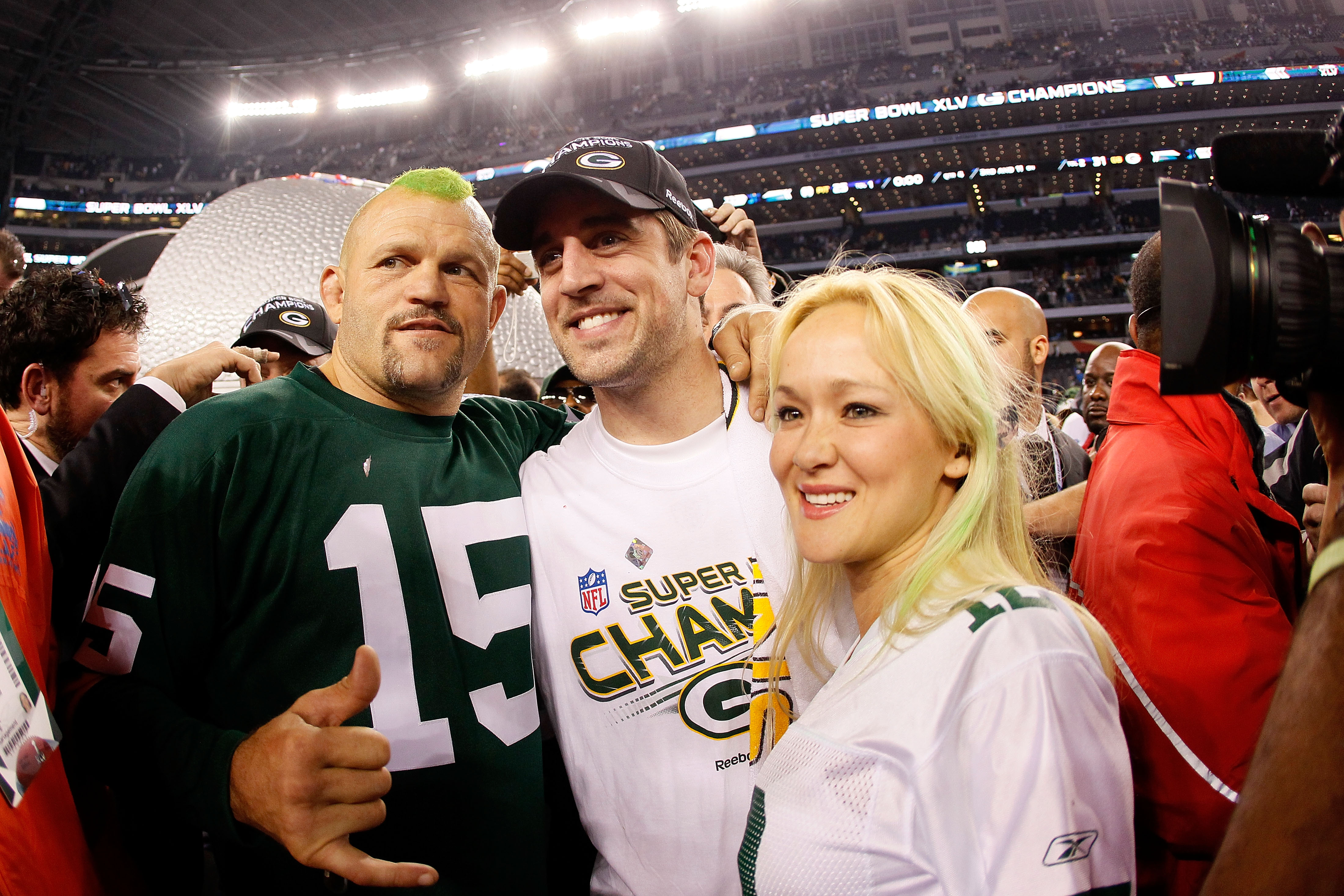 ARLINGTON, TX - FEBRUARY 06: Former MMA Champion Chuck Liddell, Super Bowl MVP Aaron Rodgers #12 of the Green Bay Packers and Heidi Northcott celebrate after the Packers winning Super Bowl XLV 31-25 against the Pittsburgh Steelers at Cowboys Stadium on Fe