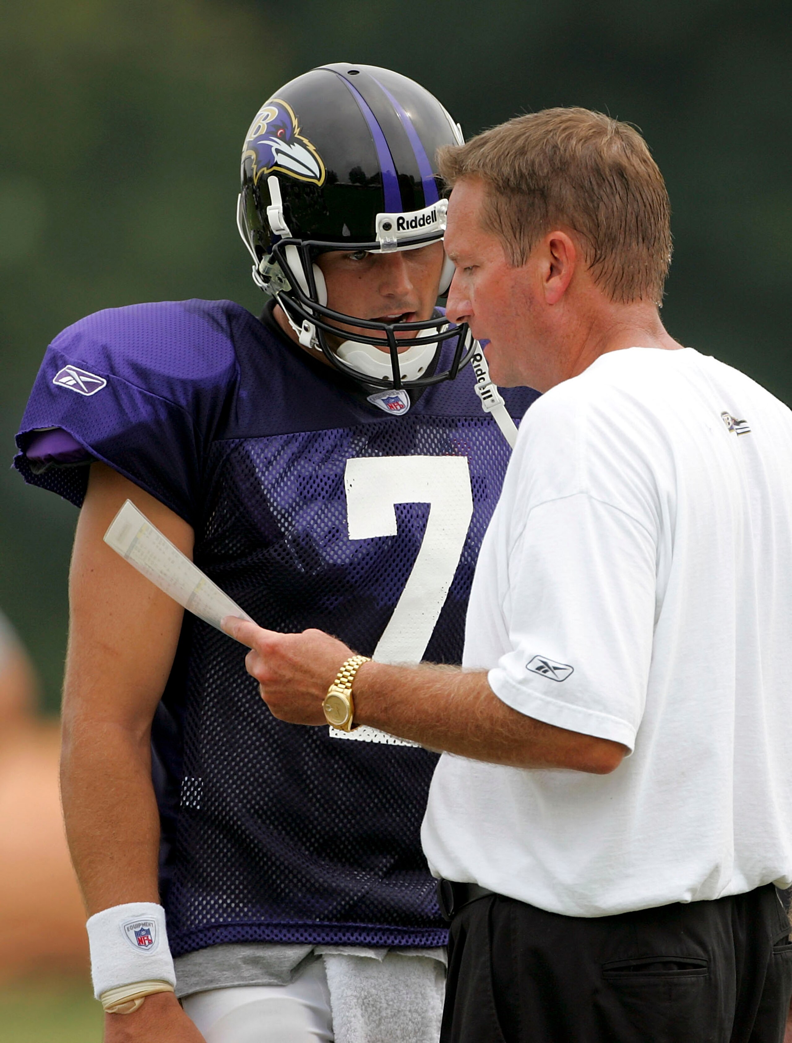 WESTMINSTER, MD - AUGUST 8:  Quarterback Kyle Boller #7 talks with offensive co-ordinator Jim Fassel during Baltimore Ravens training camp on August 8, 2005 at McDaniel College in Westminster, Maryland.  (Photo By Jamie Squire/Getty Images)
