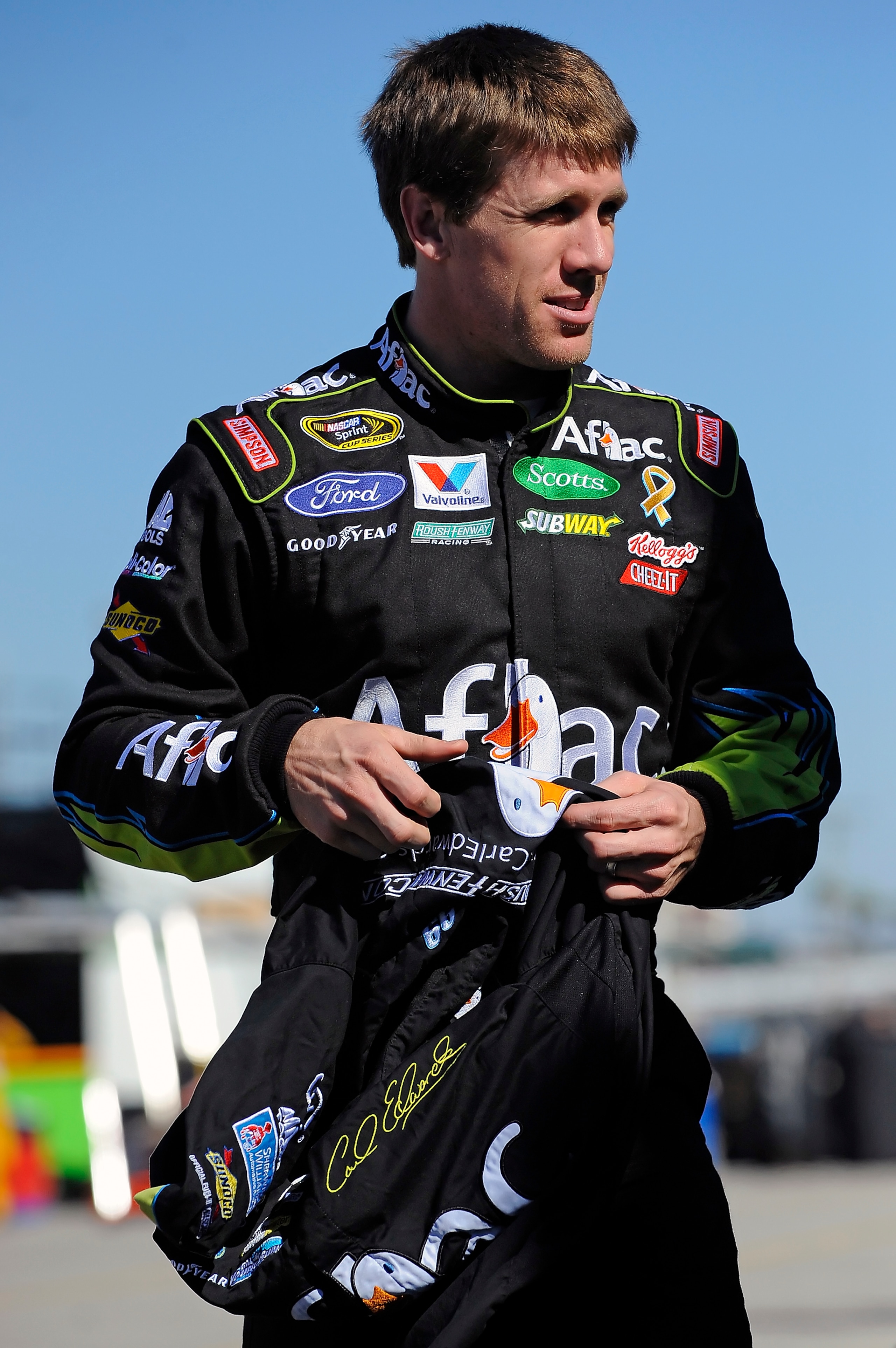 DAYTONA BEACH, FL - JANUARY 22:  Carl Edwards, driver of the #99 Aflac Ford, walks through the garage area during practice at Daytona International Speedway on January 22, 2011 in Daytona Beach, Florida.  (Photo by Jared C. Tilton/Getty Images for NASCAR)