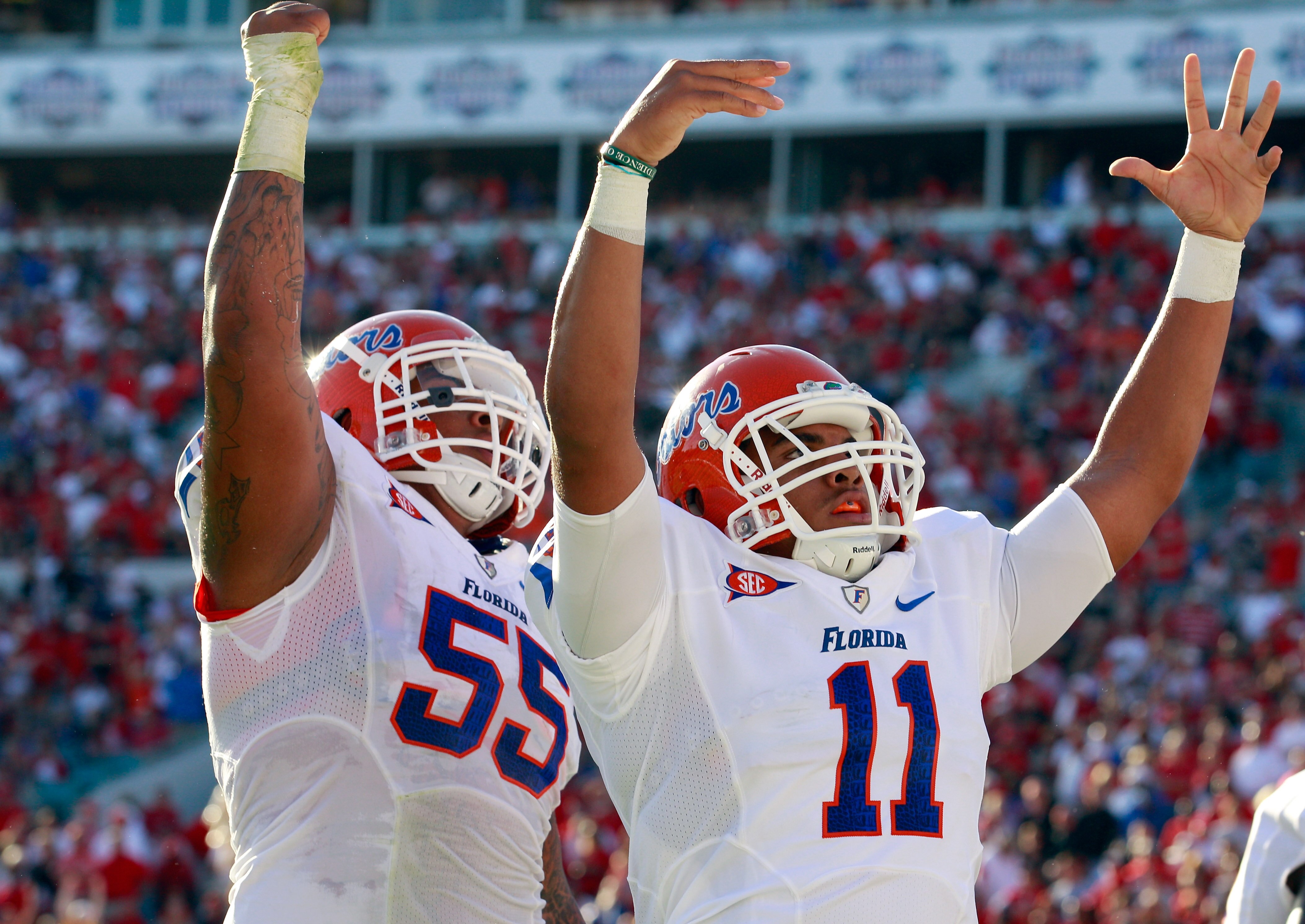 JACKSONVILLE, FL - OCTOBER 30:  Jordan Reed #11 and Mike Pouncey #55 of the Florida Gators celebrate a touchdown during the game against the Georgia Bulldogs at EverBank Field on October 30, 2010 in Jacksonville, Florida.  (Photo by Sam Greenwood/Getty Im