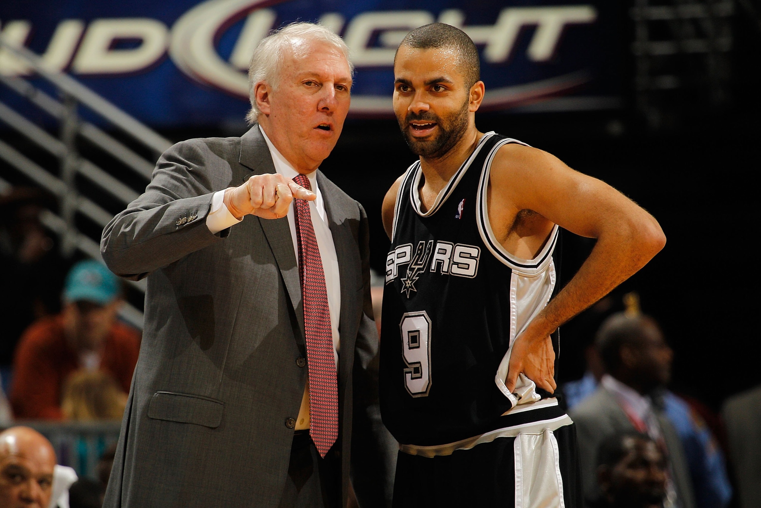 NEW ORLEANS - JANUARY 18:  Head coach Gregg Popovich and Tony Parker #9 of the San Antonio Spurs talk during a timeout against the New Orleans Hornets at New Orleans Arena on January 18, 2010 in New Orleans, Louisiana.   NOTE TO USER: User expressly ackno