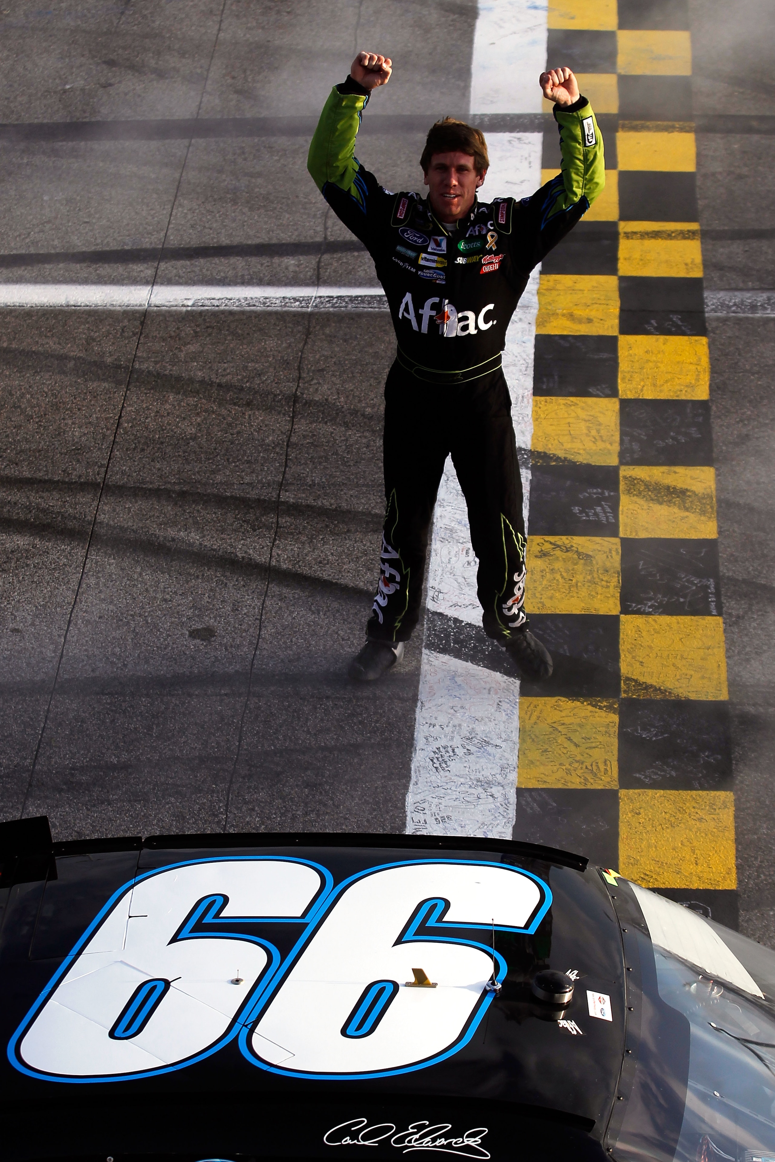 HOMESTEAD, FL - NOVEMBER 21:  Carl Edwards, driver of the #99 Aflac Ford, celebrates after winning the NASCAR Sprint Cup Series Ford 400 at Homestead-Miami Speedway on November 21, 2010 in Homestead, Florida.  (Photo by Todd Warshaw/Getty Images for NASCA