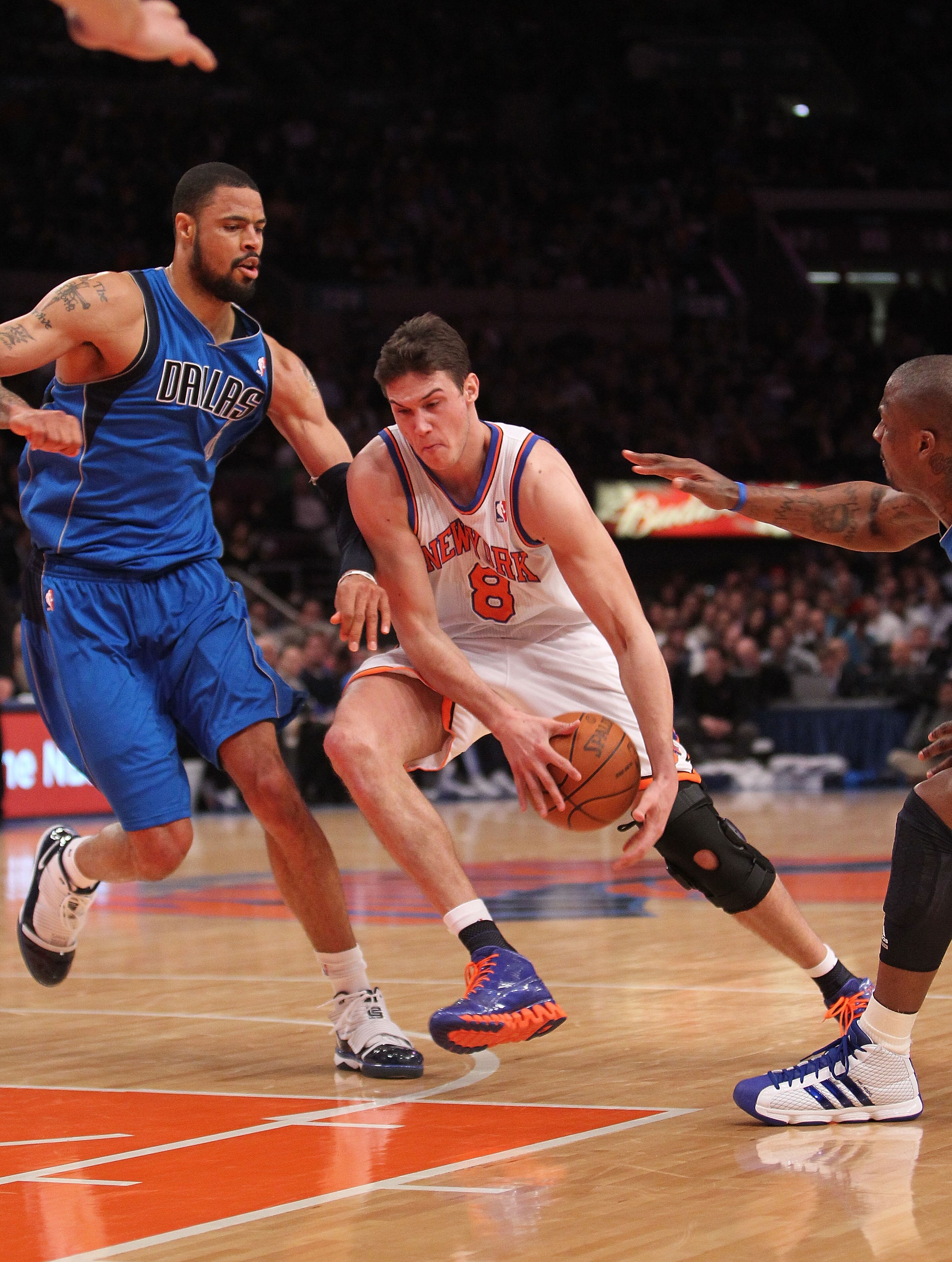 NEW YORK, NY - FEBRUARY 02:  Danilo Gallinari #8 of the New York Knicks drives to the basket against Tyson Chandler #6 of the Dallas Mavericks at Madison Square Garden on February 2, 2011 in New York City. NOTE TO USER: User expressly acknowledges and agr