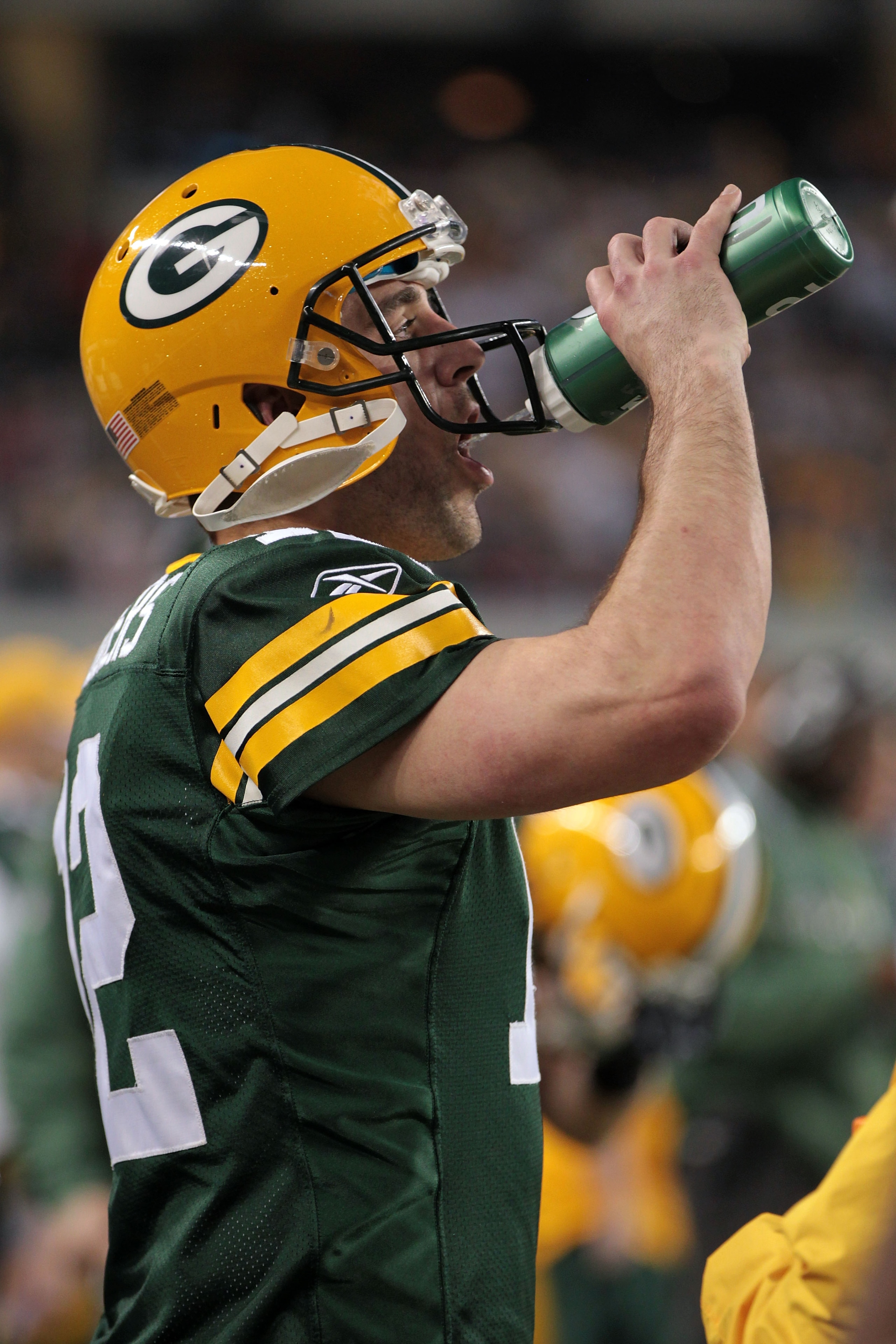 ARLINGTON, TX - FEBRUARY 06:  Aaron Rodgers #12 of the Green Bay Packers drinks on the sideline in the fourth quarter against the Pittsburgh Steelers during Super Bowl XLV at Cowboys Stadium on February 6, 2011 in Arlington, Texas.  (Photo by Jamie Squire