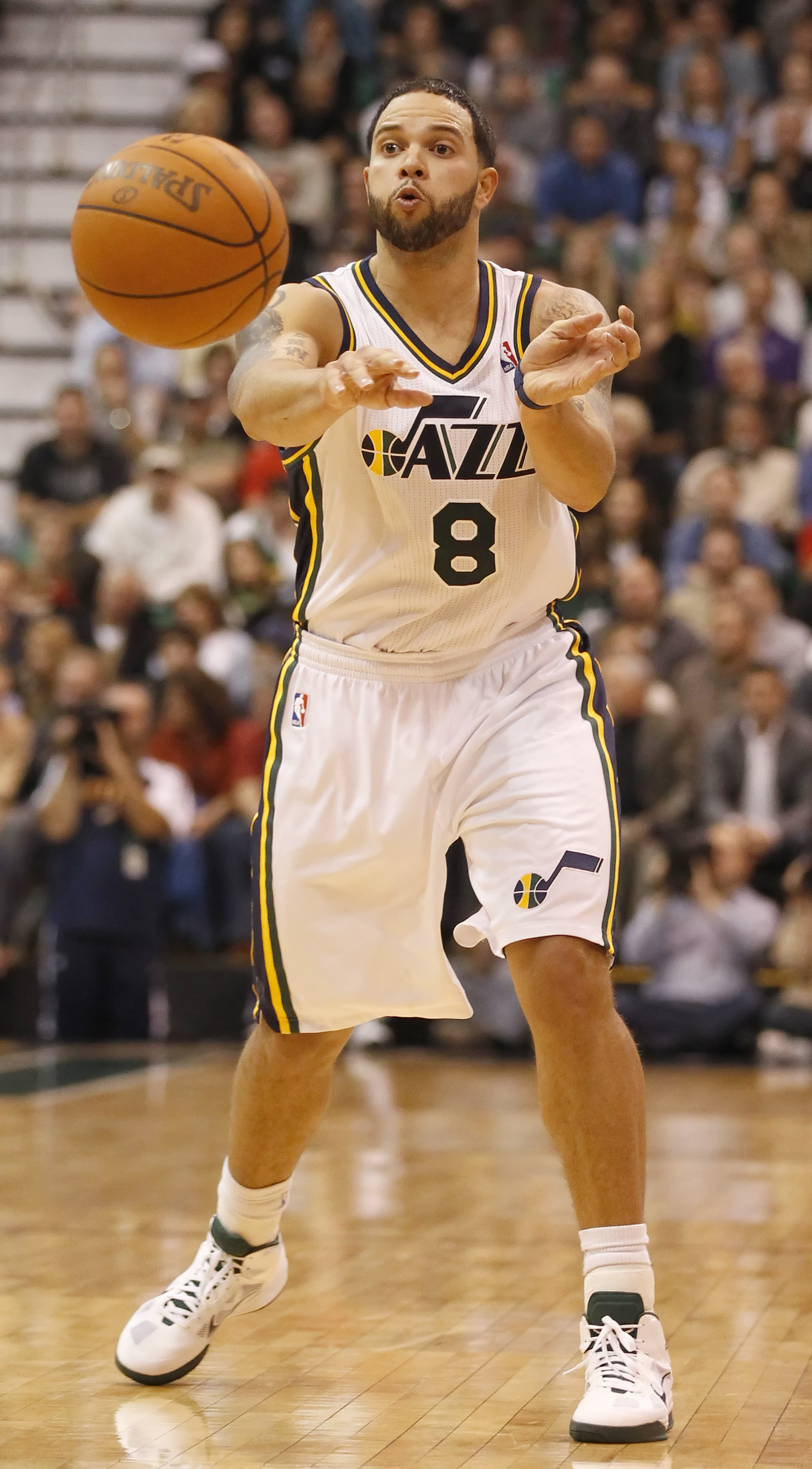 SALT LAKE CITY, UT - DECEMBER 8:  Deron Williams #8 of the Utah Jazz passes the ball during a game against the Miami Heat during the second half of an NBA game December 8, 2010 at Energy Solutions Arena in Salt Lake City, Utah. The Heat beat the Jazz 111-