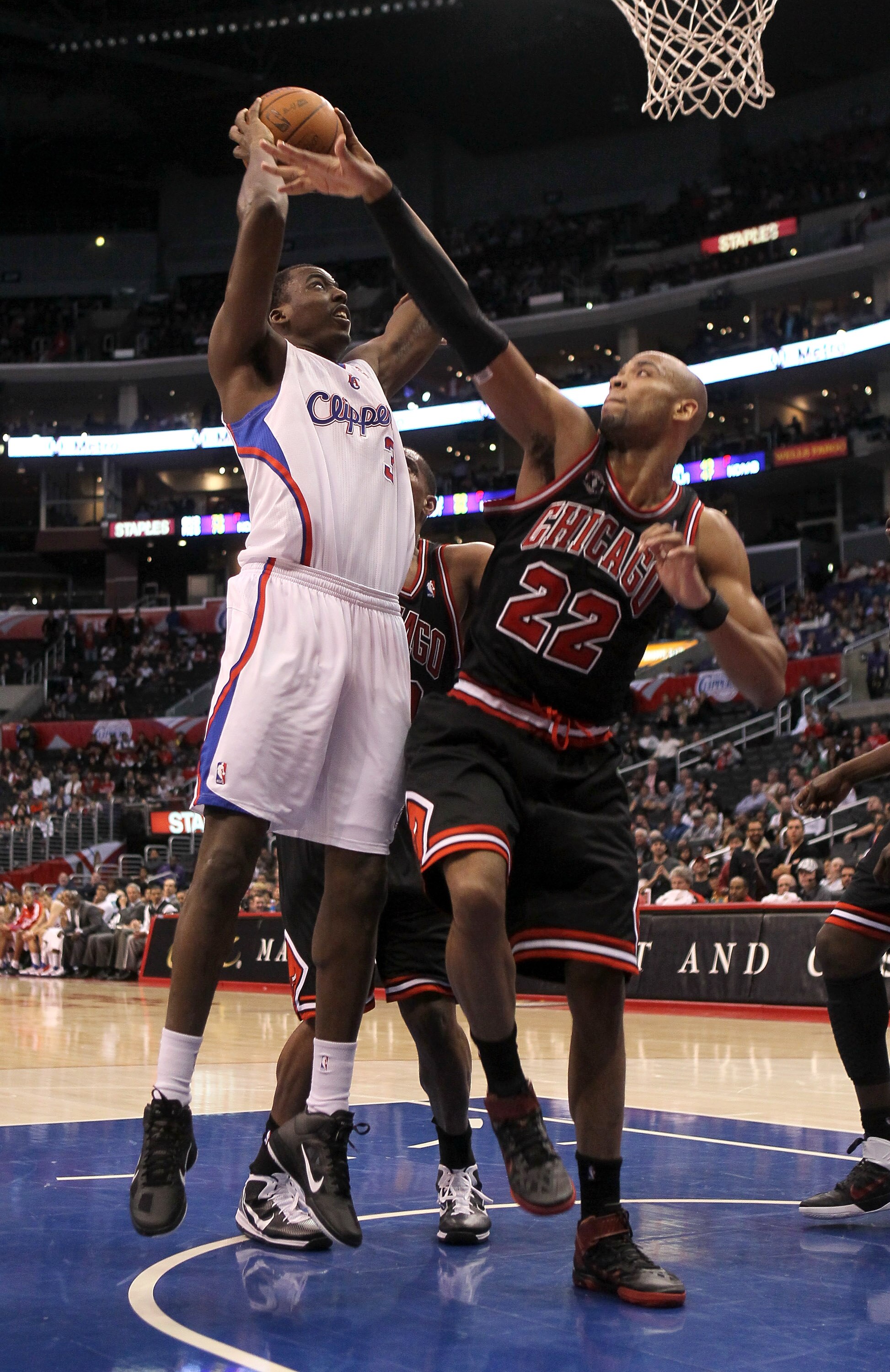 LOS ANGELES, CA - FEBRUARY 2:   Al-Farouq Aminu #3 of the Los Angeles Clippers shoots over Taj Gibson #22 of the Chicago Bulls at Staples Center on February 2, 2011  in Los Angeles, California. The Bulls won 106-88.  NOTE TO USER: User expressly acknowled
