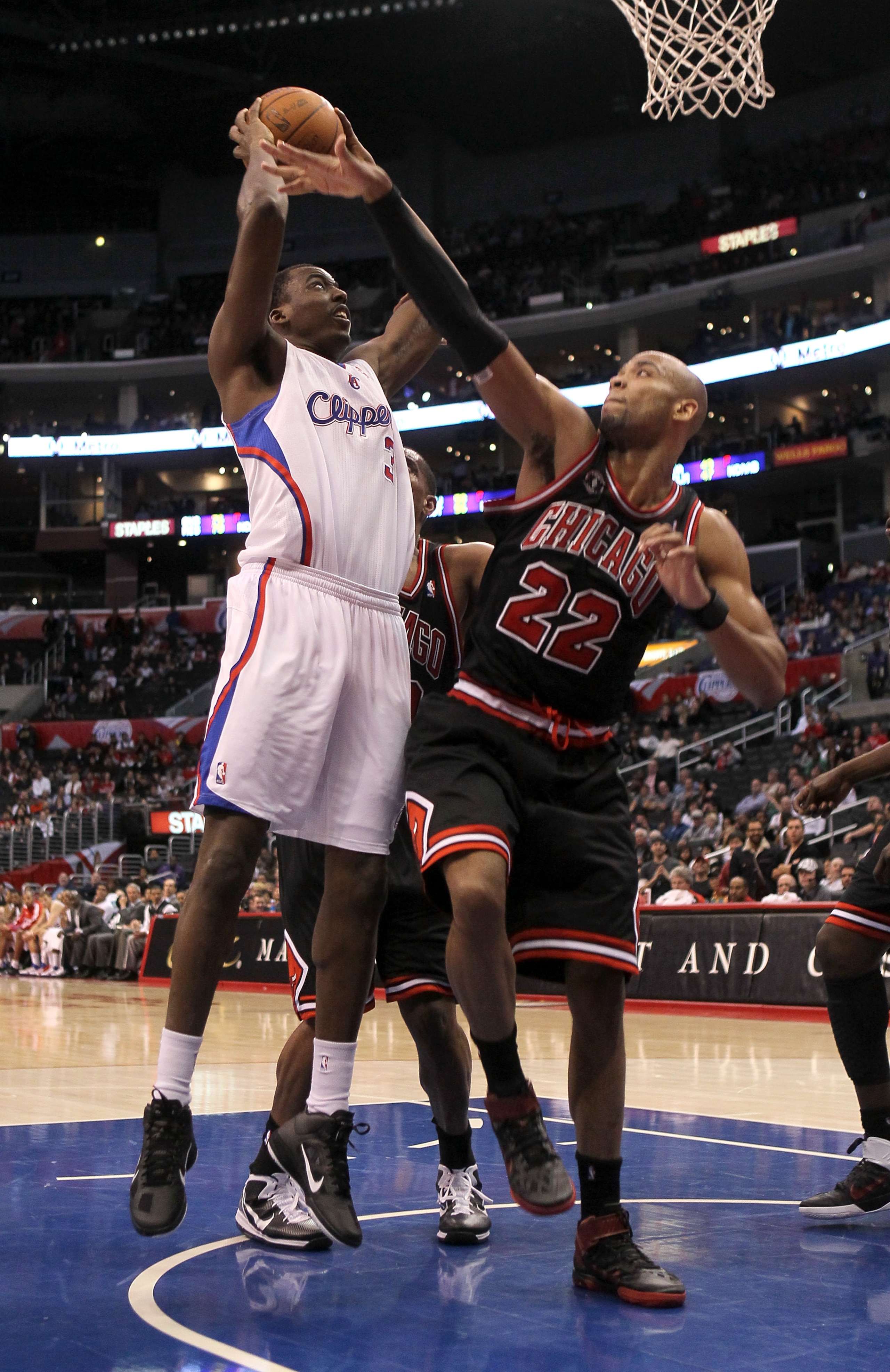 LOS ANGELES, CA - FEBRUARY 2:   Al-Farouq Aminu #3 of the Los Angeles Clippers shoots over Taj Gibson #22 of the Chicago Bulls at Staples Center on February 2, 2011  in Los Angeles, California. The Bulls won 106-88.  NOTE TO USER: User expressly acknowled