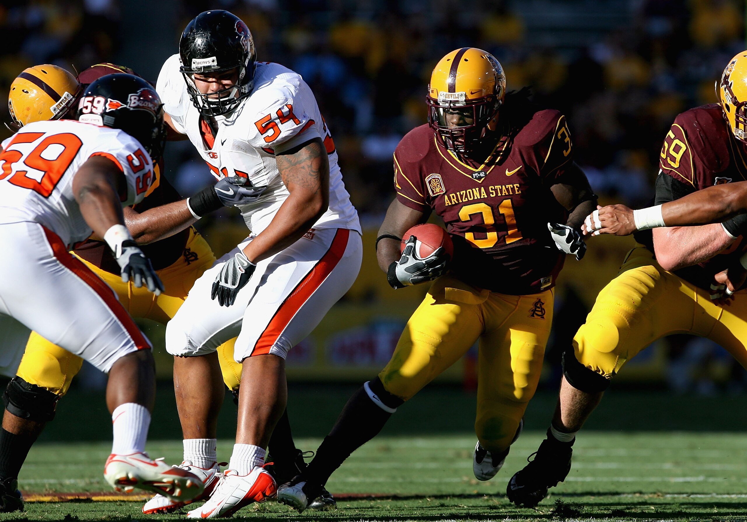 TEMPE, AZ - OCTOBER 03:  Runningback Dimitri Nance #31 of the Arizona State Sun Devils carries the ball for a 9 yard rush past Stephen Paea #54 of the Oregon State Beavers during the college football game at Sun Devil Stadium on October 3, 2009 in Tempe,