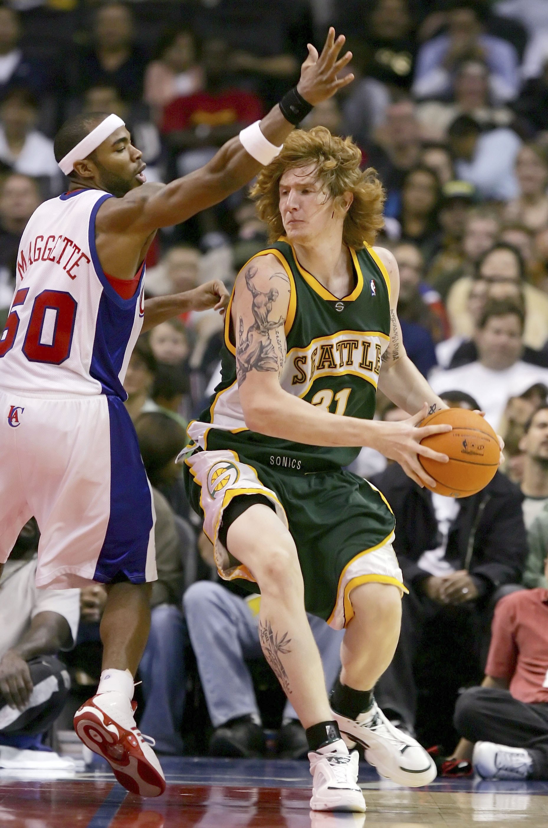 LOS ANGELES - OCTOBER 21:   Robert Swift #31 of the Seattle SuperSonics looks to pass against Corey Maggette #50 of the Los Angeles Clippers on October 21, 2006 at Staples Center in Los Angeles, California. The Clippers won 86-82.  NOTE TO USER: User expr