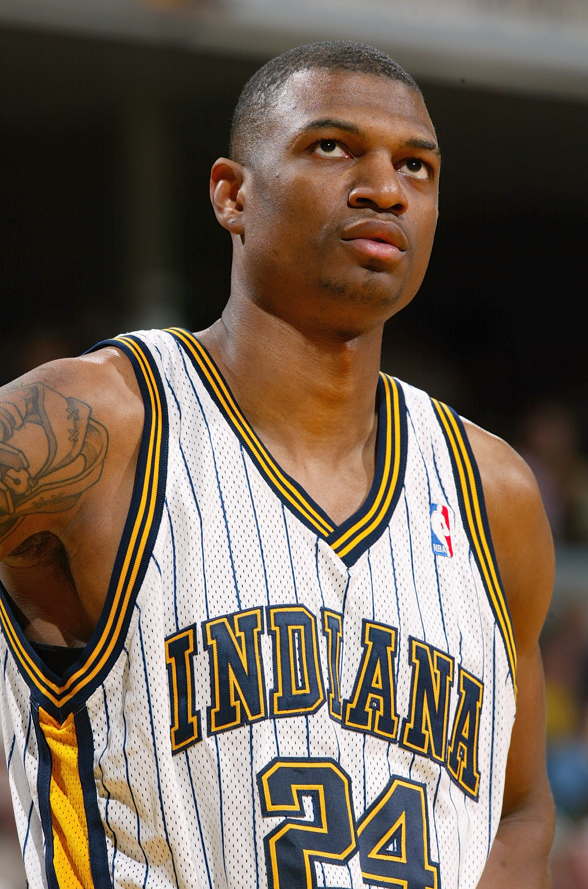 INDIANAPOLIS - MARCH 9:   Jonathan Bender #24 of the Indiana Pacers looks on against the Toronto Raptors during the game at Conseco Fieldhouse on March 9, 2004 in Indianapolis, Indiana.  The Pacers won 94-84.   NOTE TO USER: User expressly acknowledges an
