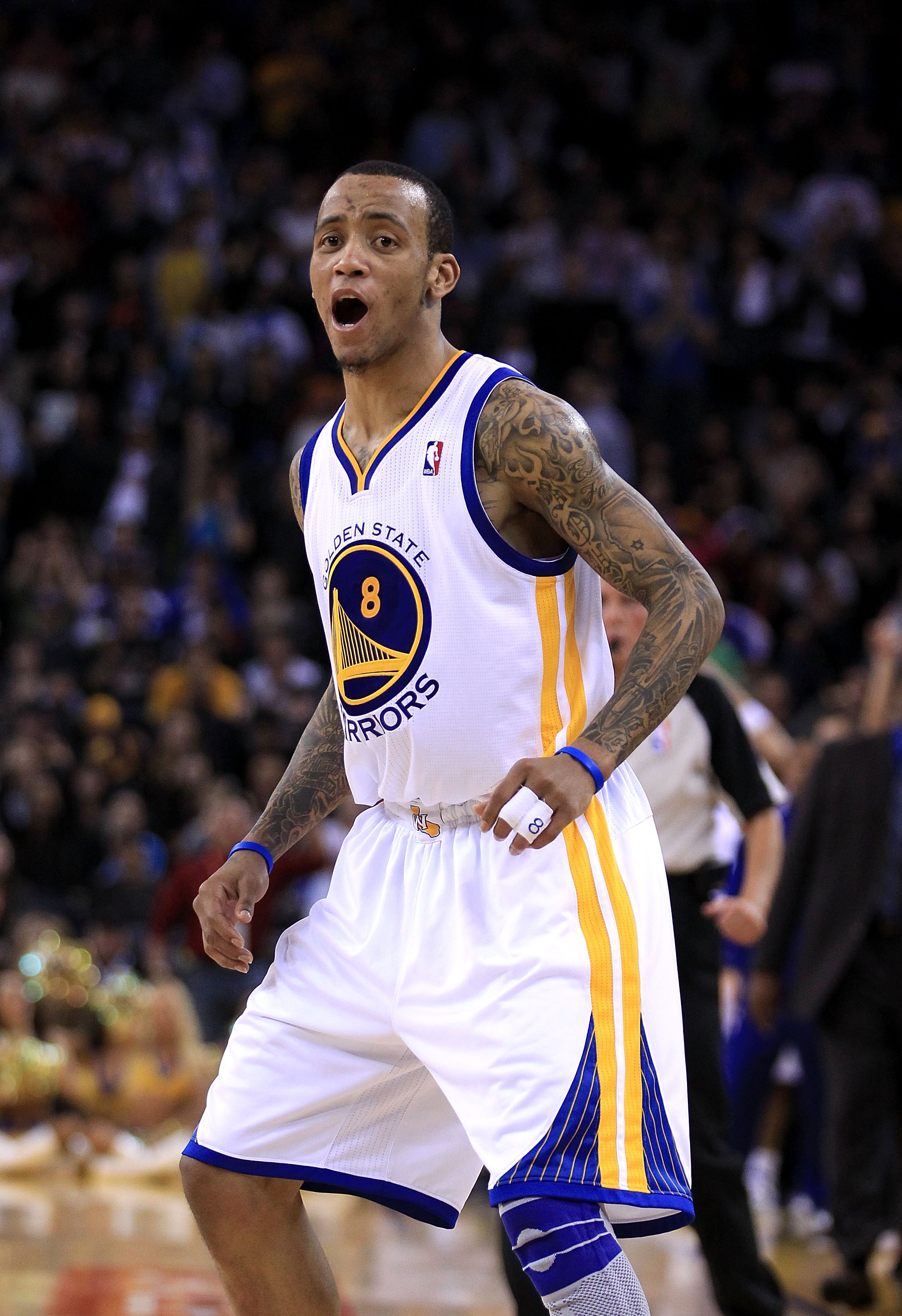OAKLAND, CA - JANUARY 21:  Monta Ellis #8 of the Golden State Warriors reacts after the Warriors made a basket during their game against the Sacramento Kings at Oracle Arena on January 21, 2011 in Oakland, California. NOTE TO USER: User expressly acknowle