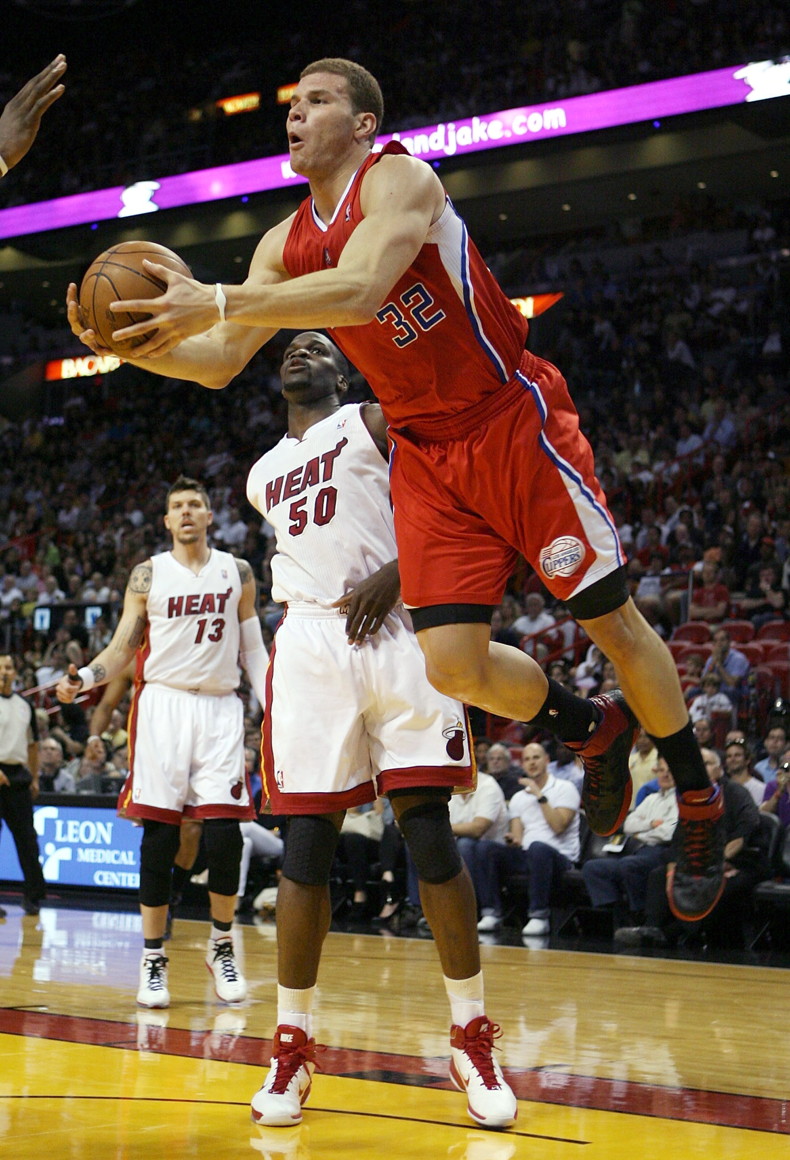 MIAMI, FL - FEBRUARY 06: Forward Blake Griffin #32 of the  Los Angeles Clippers drives past Joel Anthony #50 of the Miami Heat at American Airlines Arena on February 6, 2011 in Miami, Florida. NOTE TO USER: User expressly acknowledges and agrees that, by