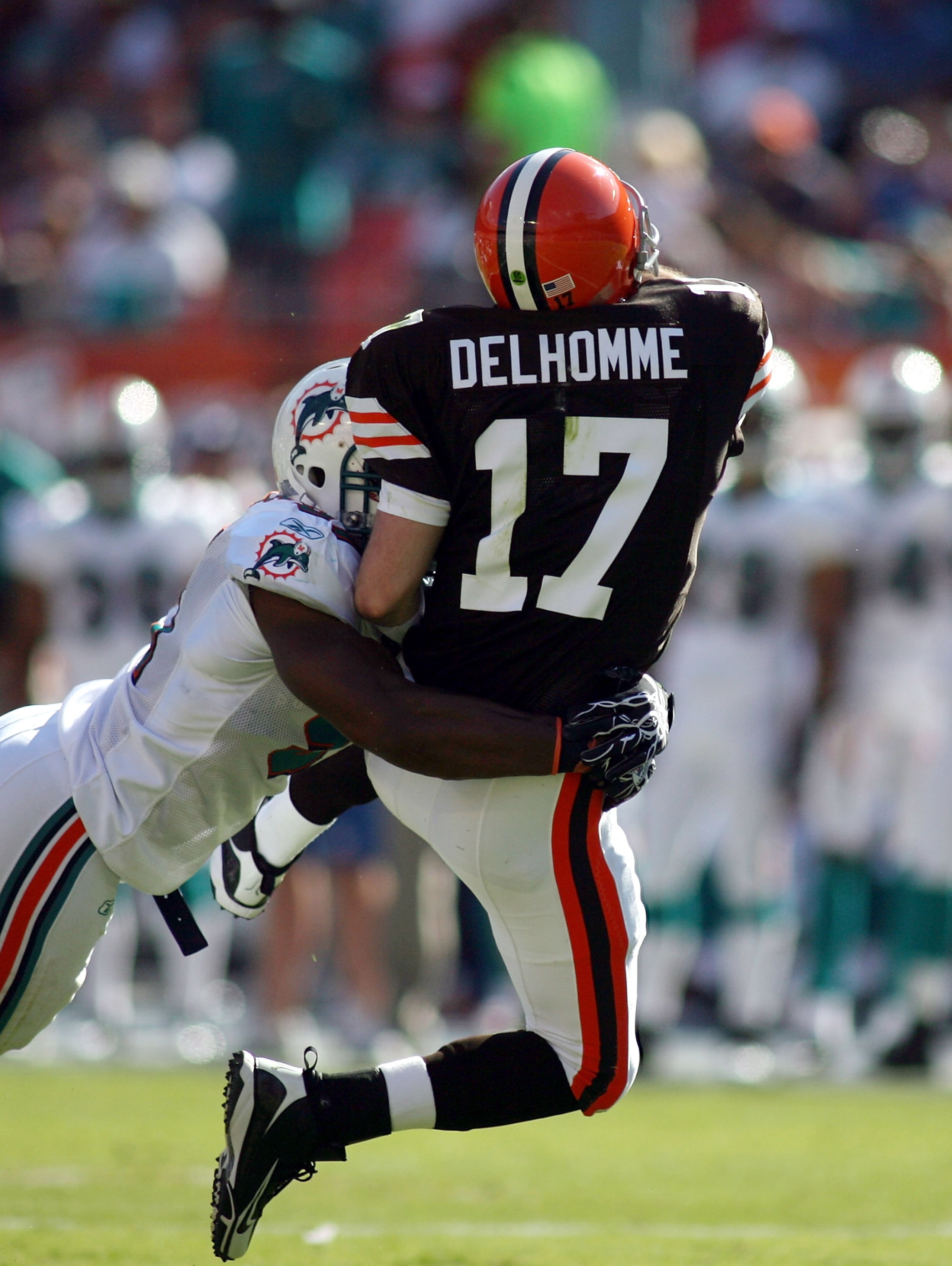 MIAMI - DECEMBER 05: Quarterback Jake Delhomme #17 of the Cleveland Browns is hit by Cameron Wake #91 of the Miami Dolphins at Sun Life Stadium on December 5, 2010 in Miami, Florida.  (Photo by Marc Serota/Getty Images)