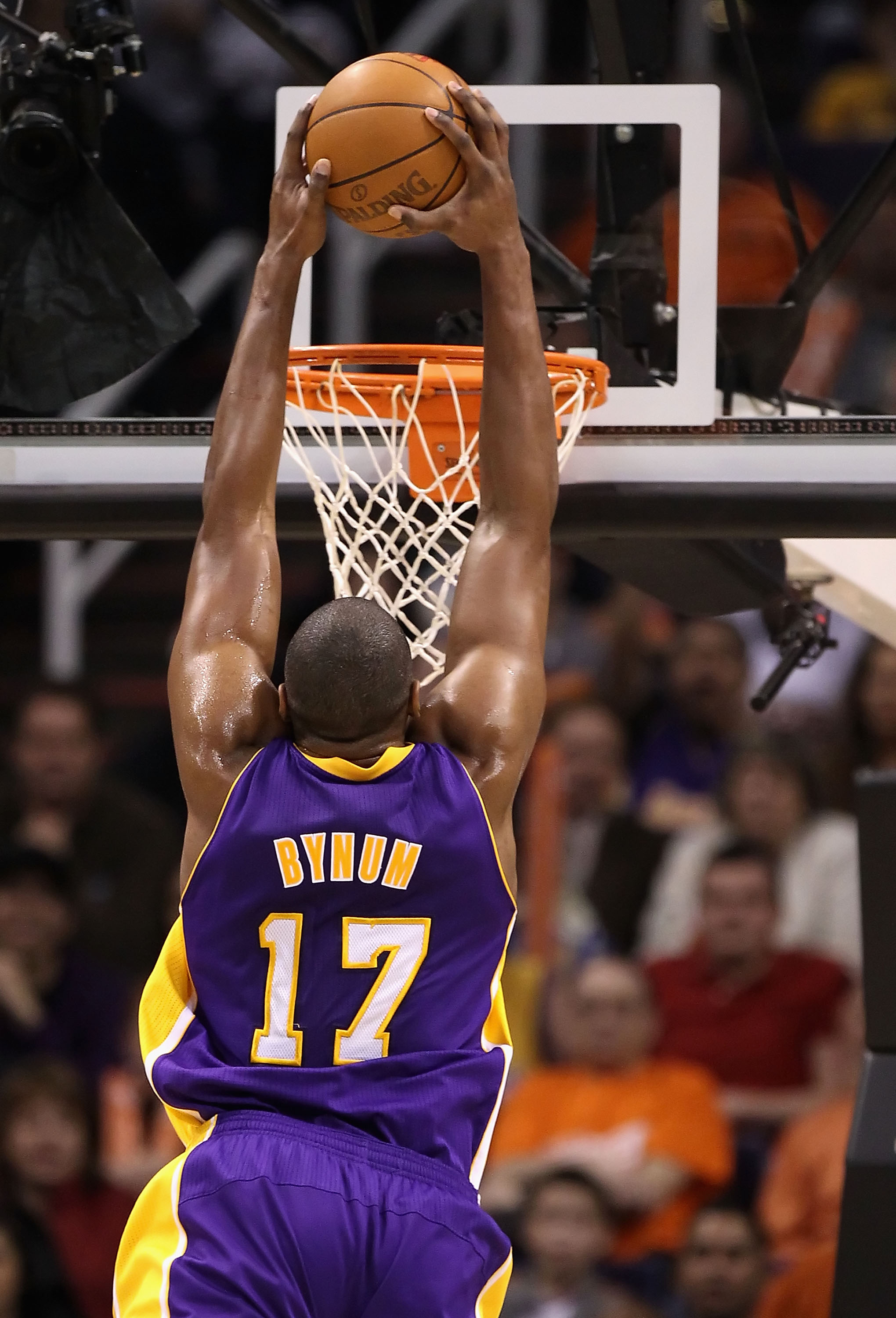PHOENIX, AZ - JANUARY 05:  Andrew Bynum #17 of the Los Angeles Lakers slam dunks during the NBA game against the Phoenix Suns at US Airways Center on December 23, 2011 in Phoenix, Arizona. The Lakers defeated the Suns 99-95.  NOTE TO USER: User expressly