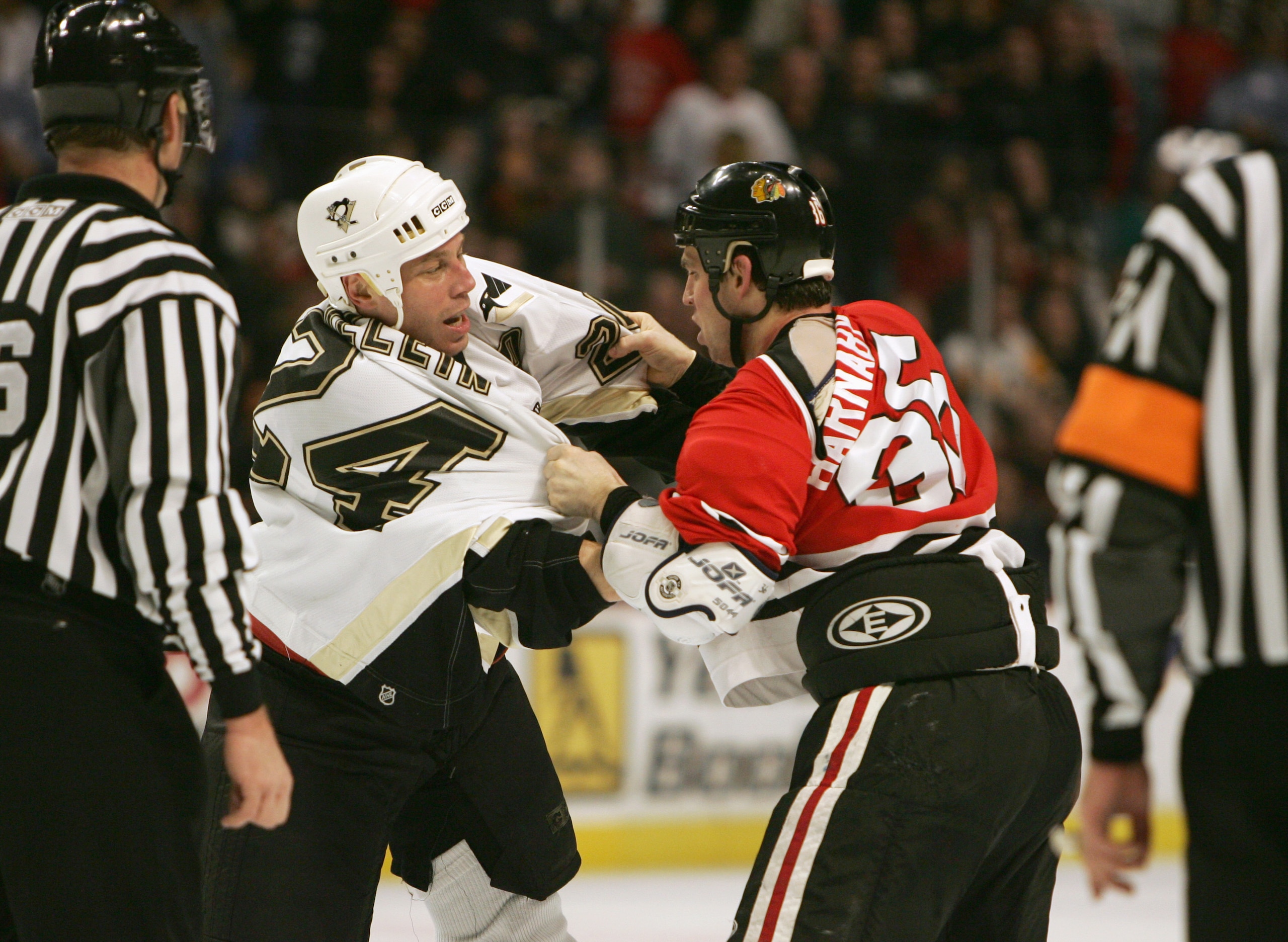 CHICAGO - JANUARY 13:  Matthew Barnaby #36 of the Chicago Blackhawks struggles against Lyle Odelein #24 of the Pittsburgh Penguins on January 13, 2006 at the United Center in Chicago, Illinois. The Blackhawks won 4-1. (Photo by Jonathan Daniel/Getty Image