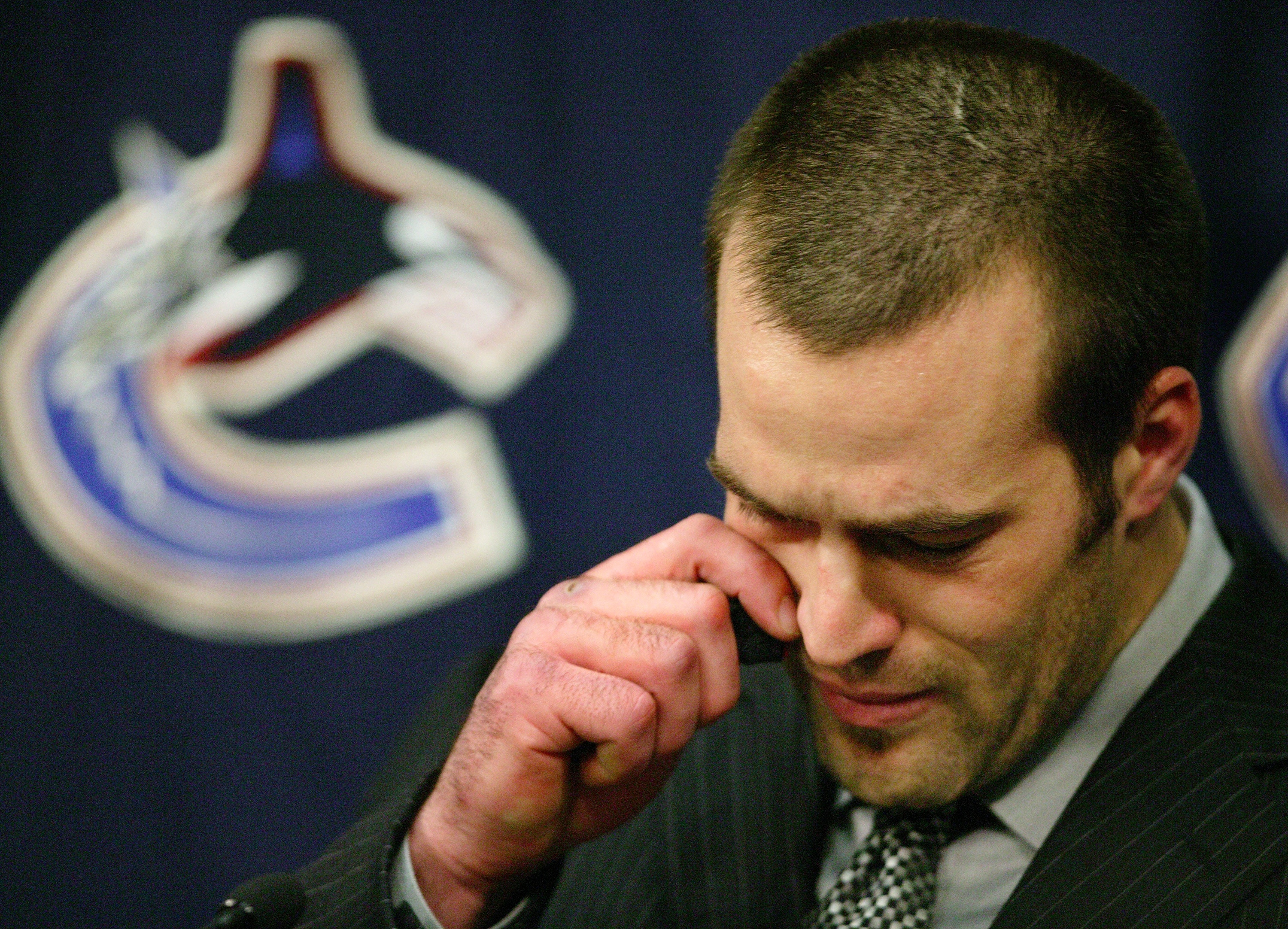 VANCOUVER - MARCH 10:   Todd Bertuzzi of the Vancouver Canucks talks to the media prior to start of the  the Canuck's NHL game against the Minnesota Wild at General Motors Place on March 10, 2004 in Vancouver, Canada.  Bertuzzi faced an NHL disciplinary h