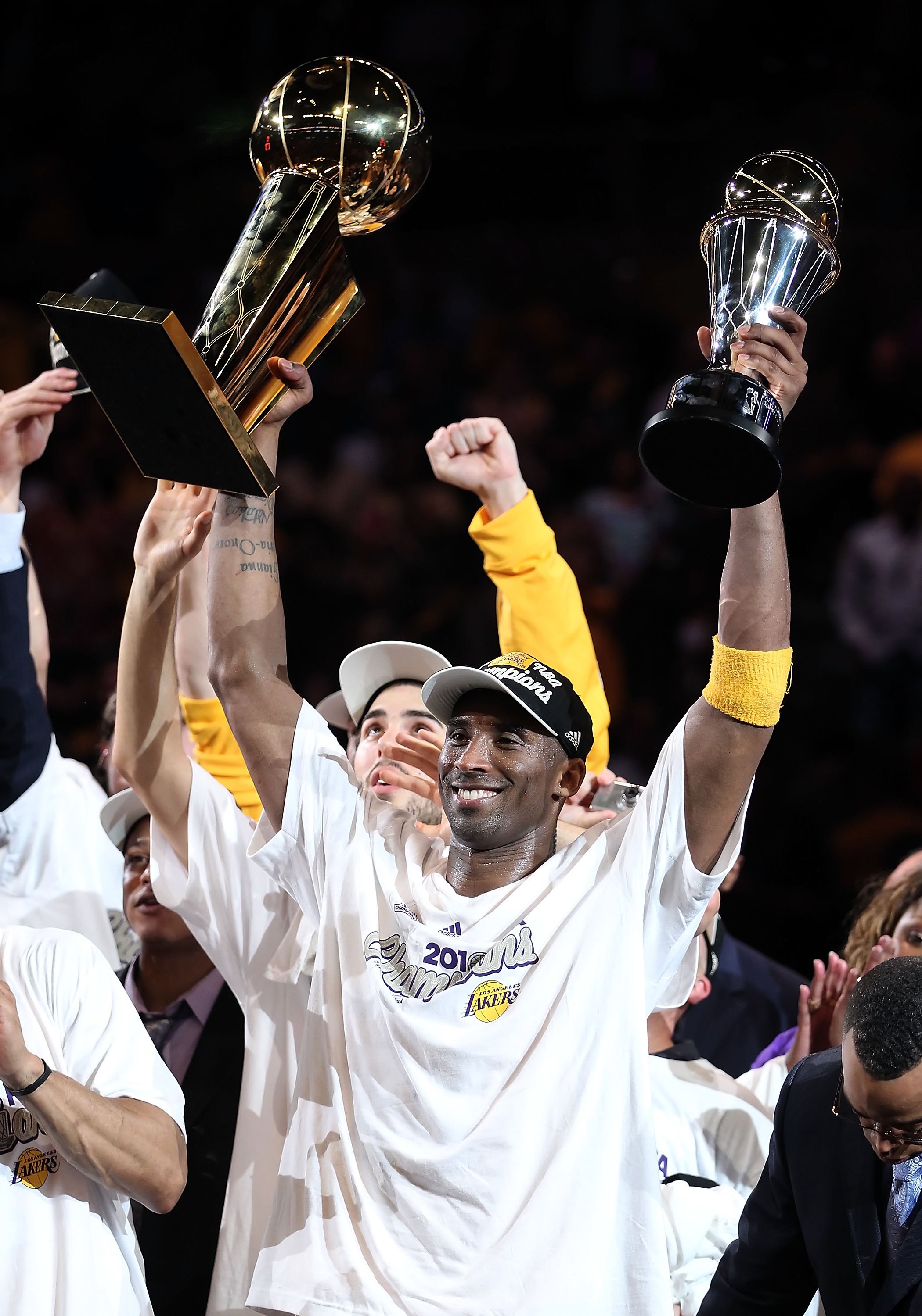 LOS ANGELES, CA - JUNE 17:  Kobe Bryant #24 of the Los Angeles Lakers holds both the Larry O'Brien trophy and the Bill Russell Finals MVP trophy after the Lakers defeated the Boston Celtics 83-79 in Game Seven of the 2010 NBA Finals at Staples Center on J