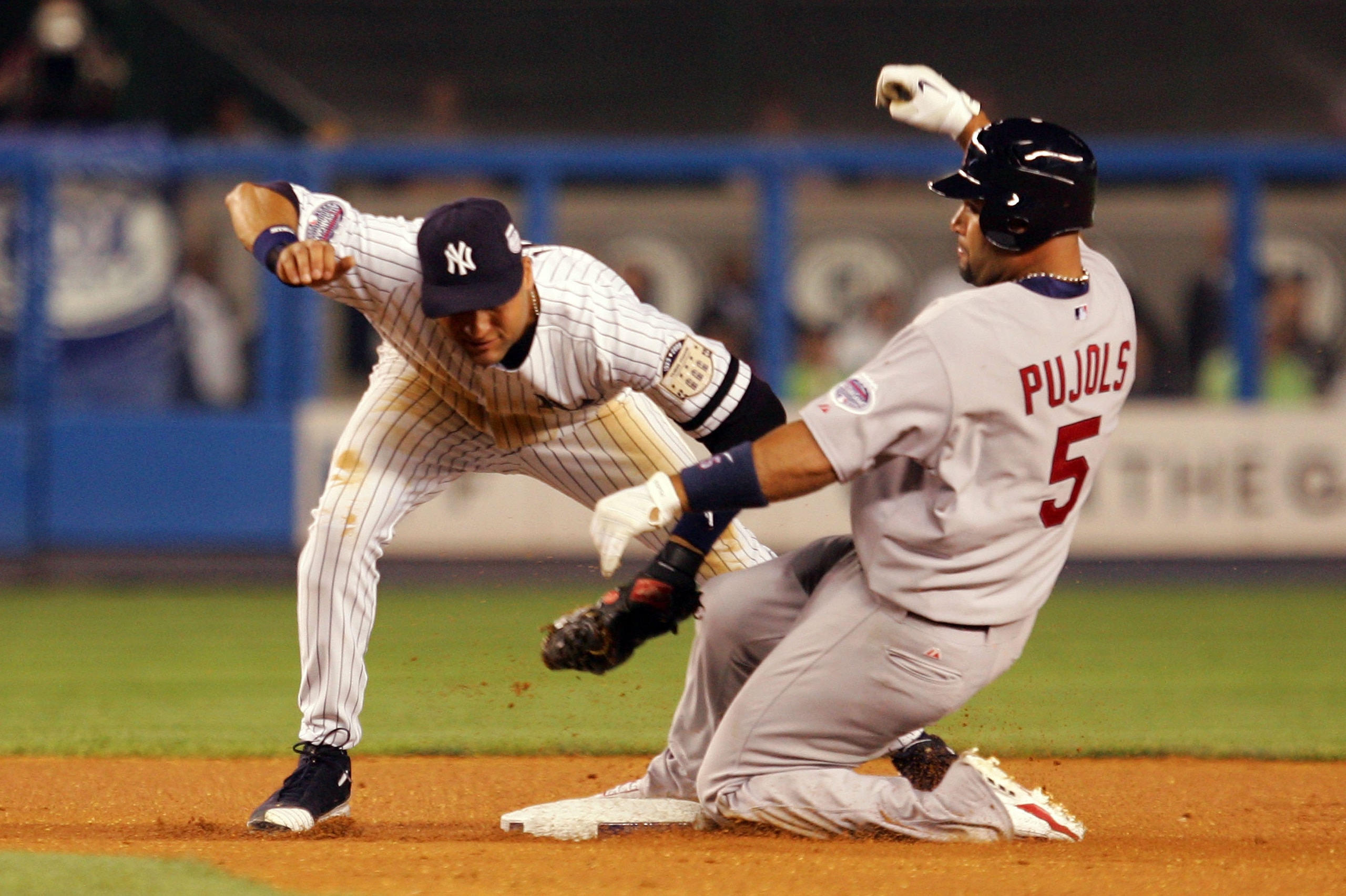 NEW YORK - JULY 15: American League All-Star Derek Jeter #2 of the New York Yankees tags out National League All-Star Albert Pujols #5 of the St. Louis Cardinals during the 79th MLB All-Star Game at Yankee Stadium on July 15, 2008 in the Bronx borough o NEW YORK - JULY 15: American League All-Star Derek Jeter #2 of the New York Yankees tags out National League All-Star Albert Pujols #5 of the St. Louis Cardinals during the 79th MLB All-Star Game at Yankee Stadium on July 15, 2008 in the Bronx borough o