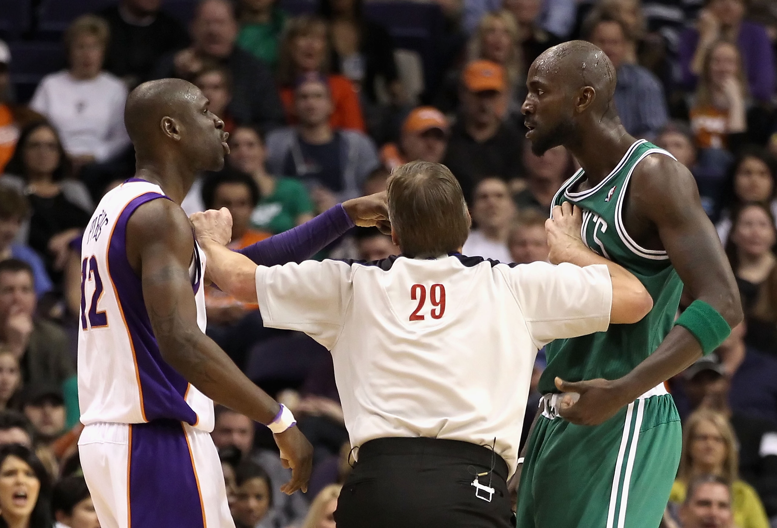 PHOENIX, AZ - JANUARY 28:  Referee Steve Javie seperates Mickael Pietrus #12 of the Phoenix Suns and Kevin Garnett #5 of the Boston Celtics after Pietrus was called for a technical foul during the NBA game at US Airways Center on January 28, 2011 in Phoen