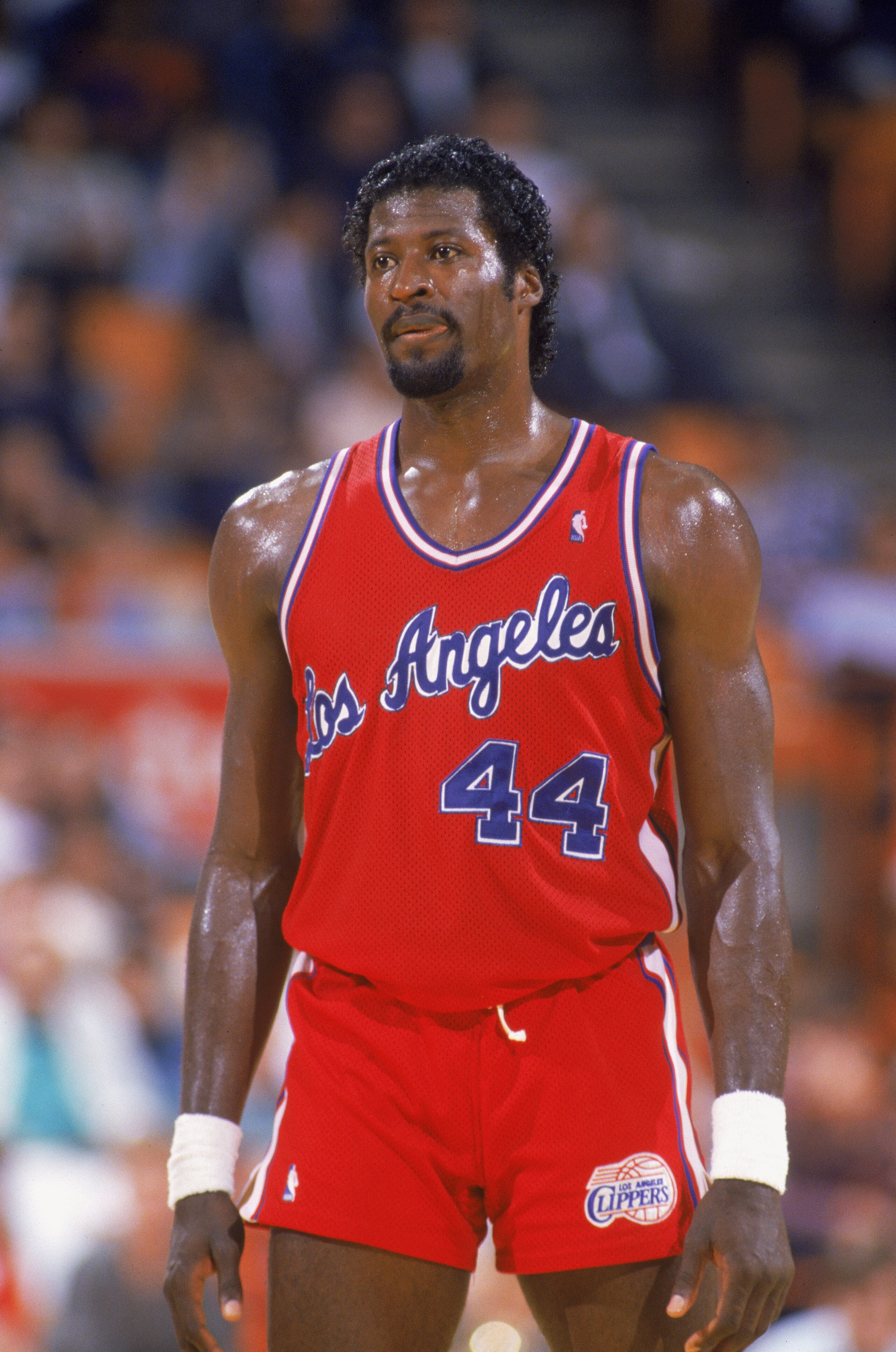 LOS ANGELES - JANUARY 1:  Michael Cage #44 of the Los Angeles Clippers walks across the court during the NBA game against the Los Angeles Lakers at the Great Western Forum, in Los Angeles, California on January 1, 1988.  NOTE TO USER: User expressly ackno