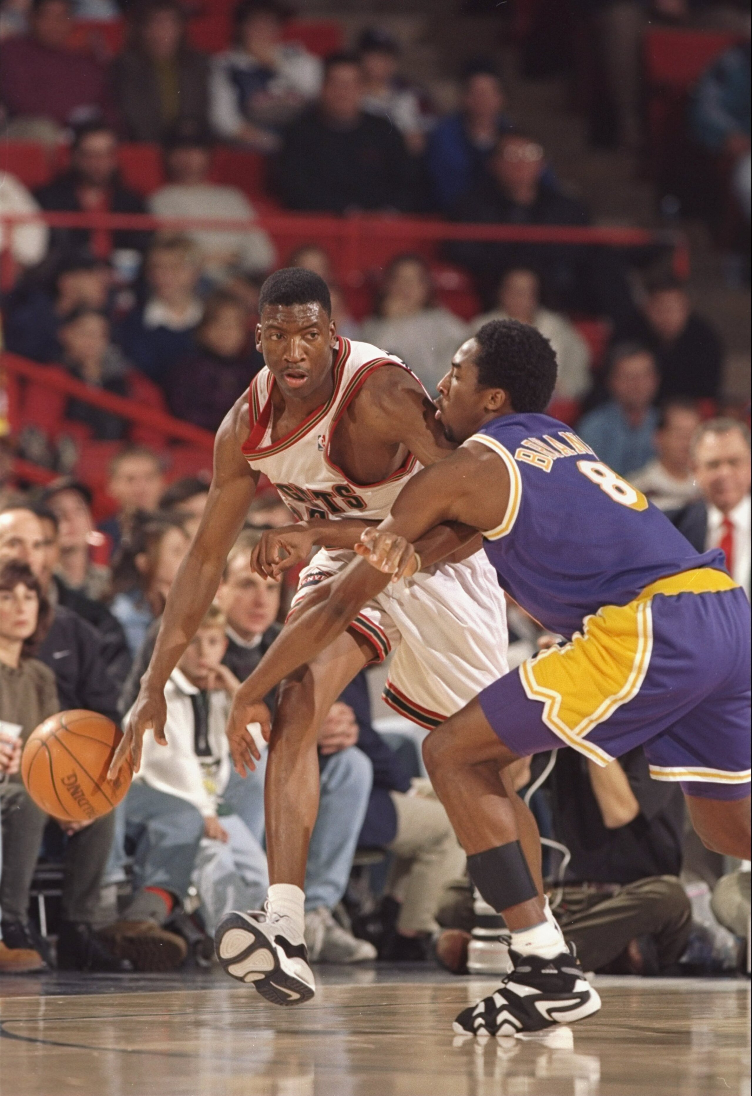 3 Dec 1997:  Forward Johnny Newman of the Denver Nuggets (left) tries to get the ball past guard Kobe Bryant of the Los Angeles Lakers during a game at the McNichols Sports Arena in Denver, Colorado.  The Lakers won the game 107-89. Mandatory Credit: Bria