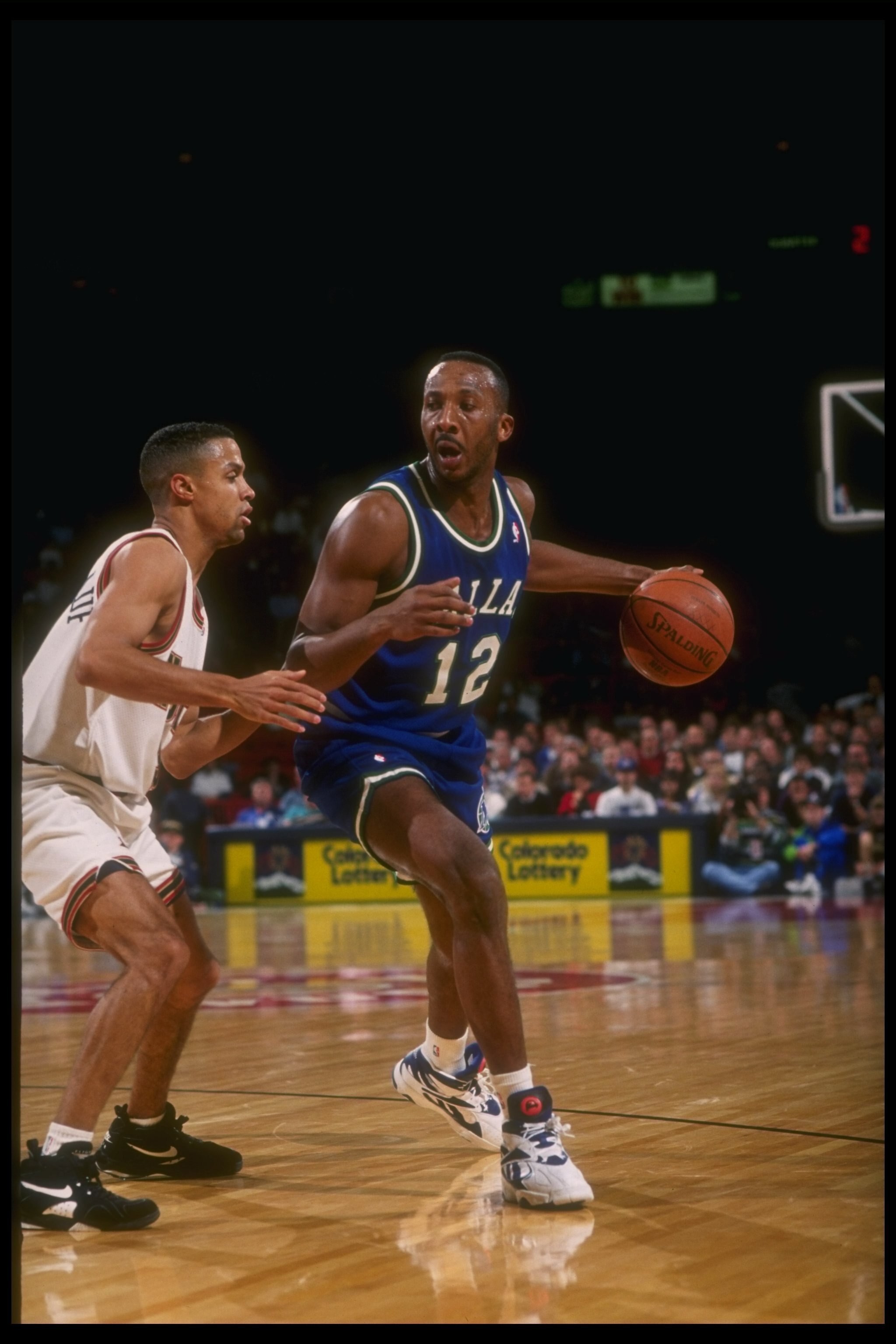 1993:  Guard Derek Harper of the Dallas Mavericks moves the ball during a game versus the Denver Nuggets at the McNichols Arena in Denver, Colorado. Mandatory Credit: Tim DeFrisco  /Allsport Mandatory Credit: Tim DeFrisco  /Allsport