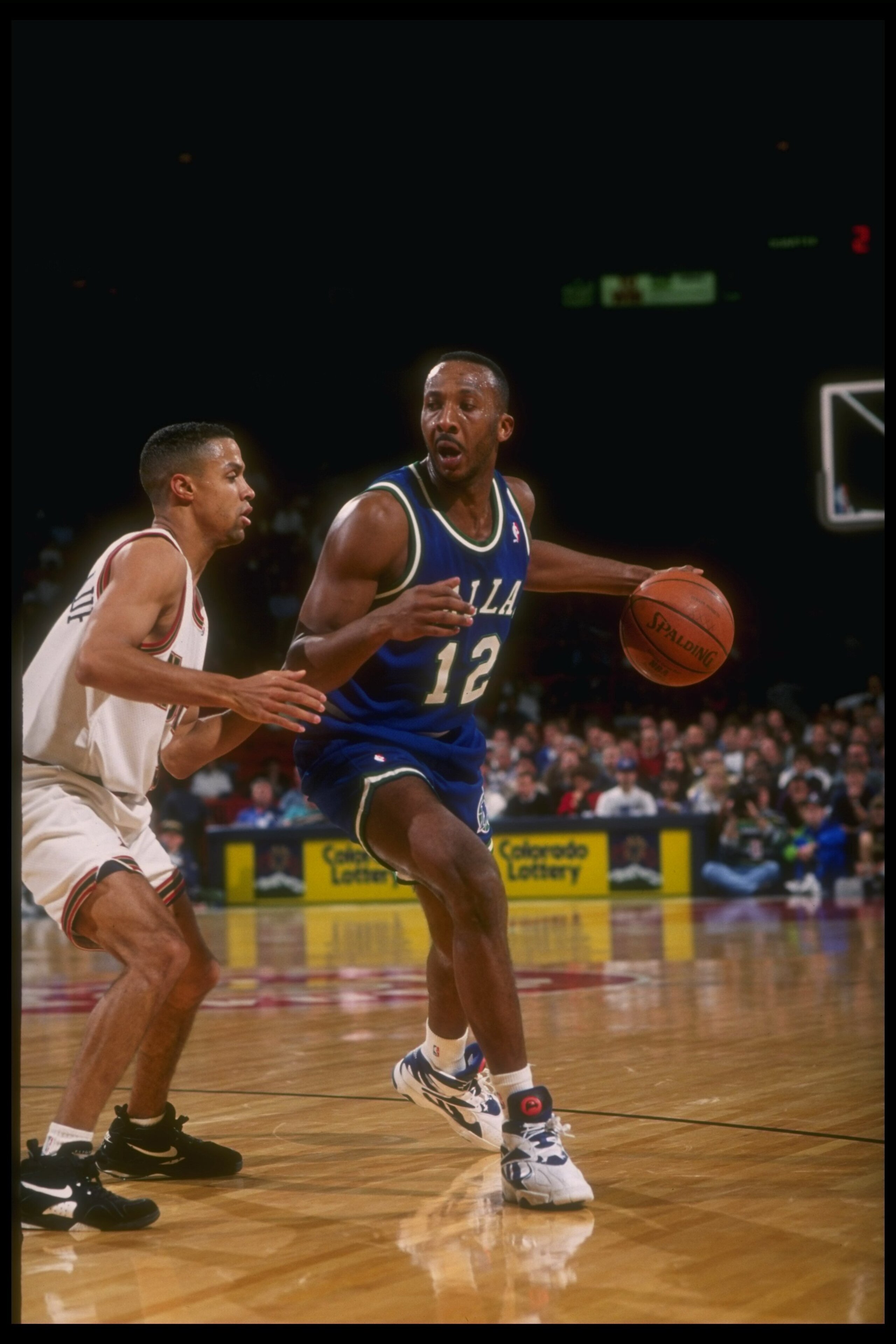 1993:  Guard Derek Harper of the Dallas Mavericks moves the ball during a game versus the Denver Nuggets at the McNichols Arena in Denver, Colorado. Mandatory Credit: Tim DeFrisco  /Allsport Mandatory Credit: Tim DeFrisco  /Allsport