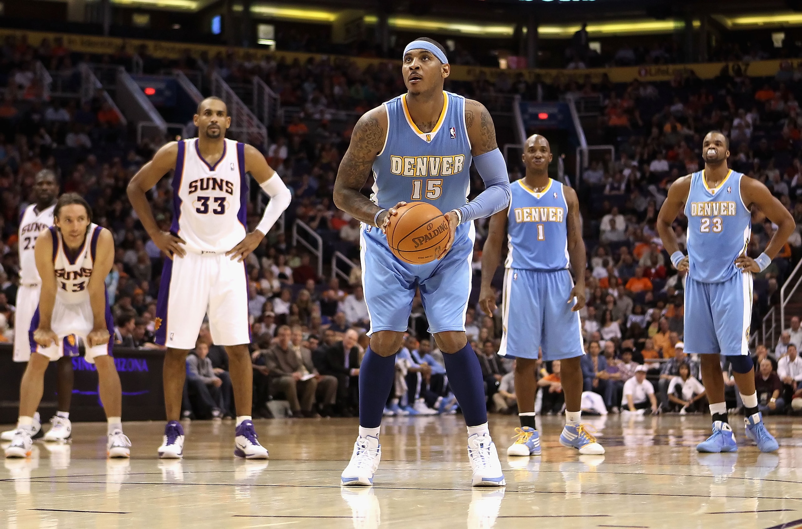 PHOENIX - NOVEMBER 15:  Carmelo Anthony #15 of the Denver Nuggets shoots a free throw shot against the Phoenix Suns during the NBA game at US Airways Center on November 15, 2010 in Phoenix, Arizona.  The Suns defeated the Nuggets 100-94.  NOTE TO USER: Us