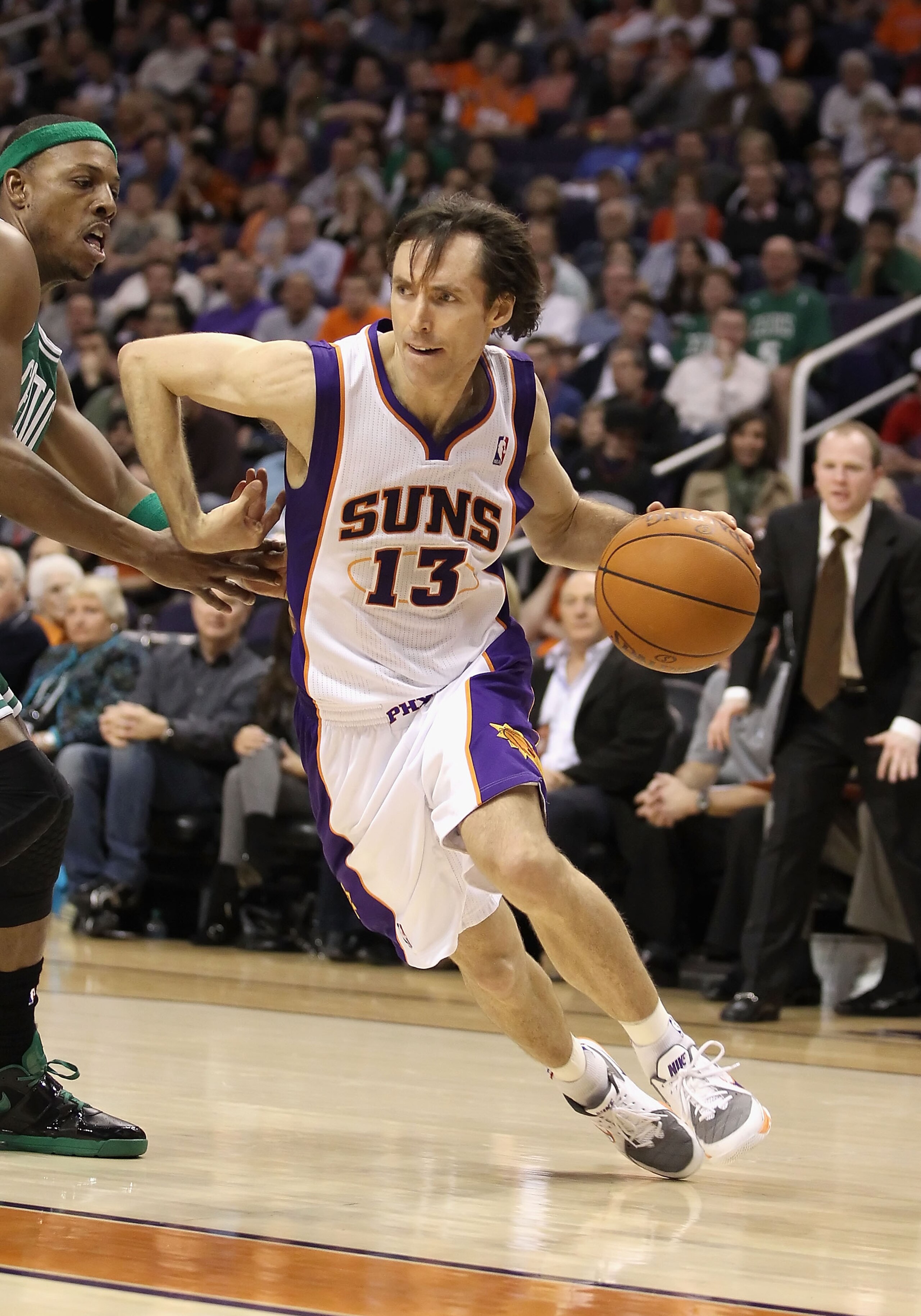 PHOENIX, AZ - JANUARY 28:  Steve Nash #13 of the Phoenix Suns drives the ball during the NBA game against the Boston Celtics at US Airways Center on January 28, 2011 in Phoenix, Arizona. The Suns defeated the Celtics 88-71. NOTE TO USER: User expressly ac