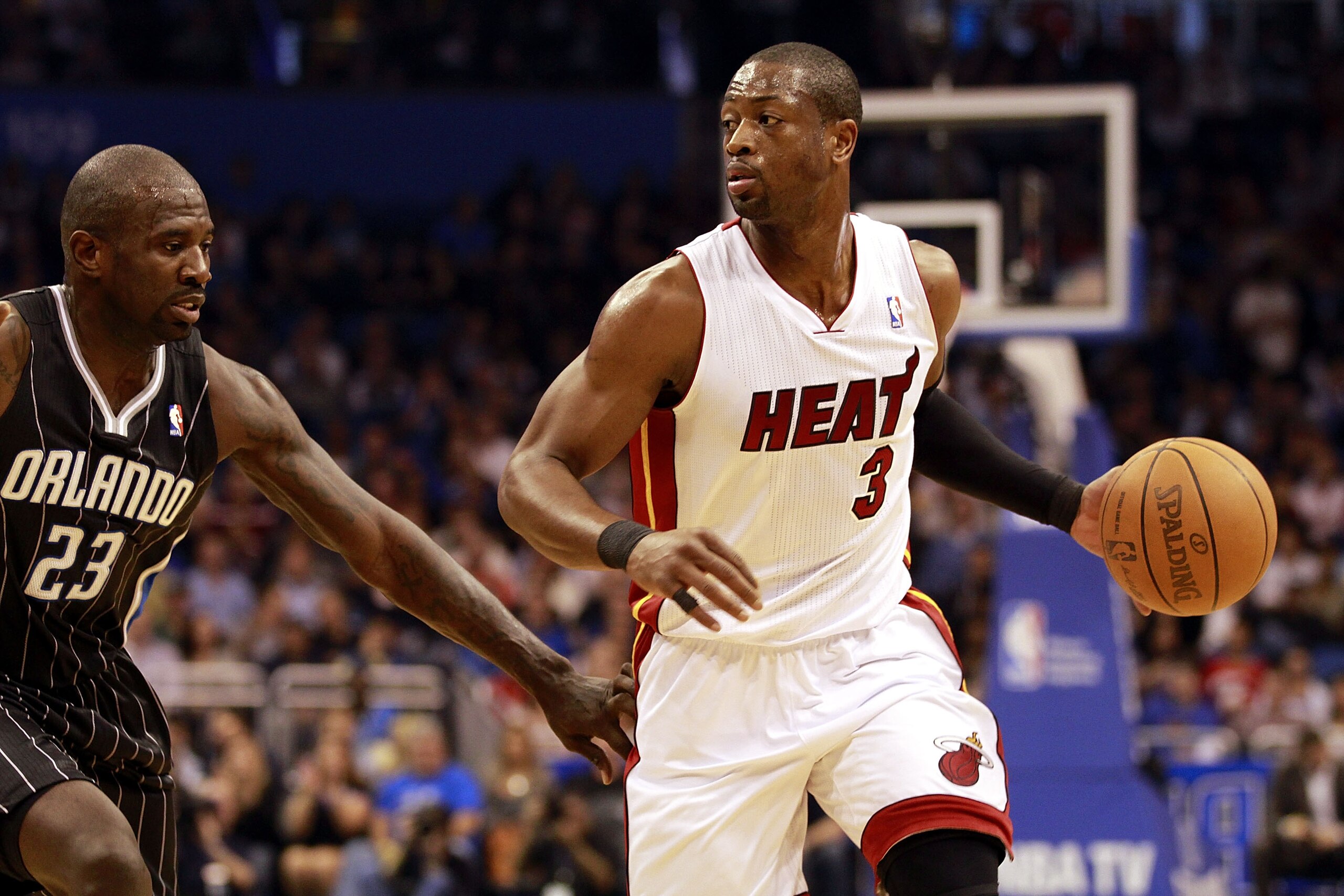ORLANDO, FL - FEBRUARY 03:  Guard Dwyane Wade #3 of the Miami Heat drives against guard Jason Richardson #23 of the Orlando Magic at Amway Arena on February 3, 2011 in Orlando, Florida. NOTE TO USER: User expressly acknowledges and agrees that, by downloa