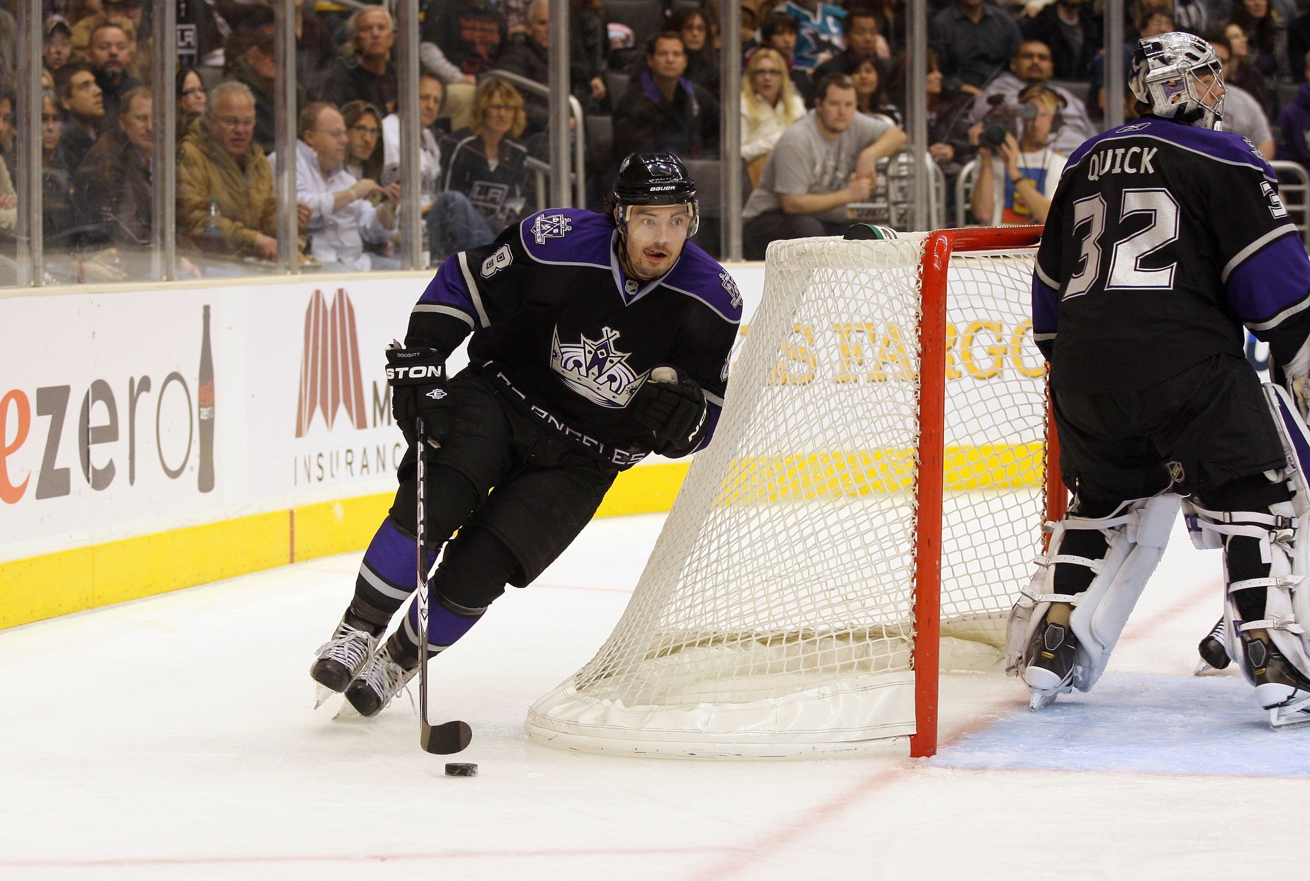 LOS ANGELES, CA - JANUARY 26: Drew Doughty #8 of the Los Angeles Kings plays the puck around the net so start the breakout play from the Kings zone against the San Jose Sharks during their NHL game at Staples Center on January 26, 2011 in Los Angeles, Ca LOS ANGELES, CA - JANUARY 26: Drew Doughty #8 of the Los Angeles Kings plays the puck around the net so start the breakout play from the Kings zone against the San Jose Sharks during their NHL game at Staples Center on January 26, 2011 in Los Angeles, Ca