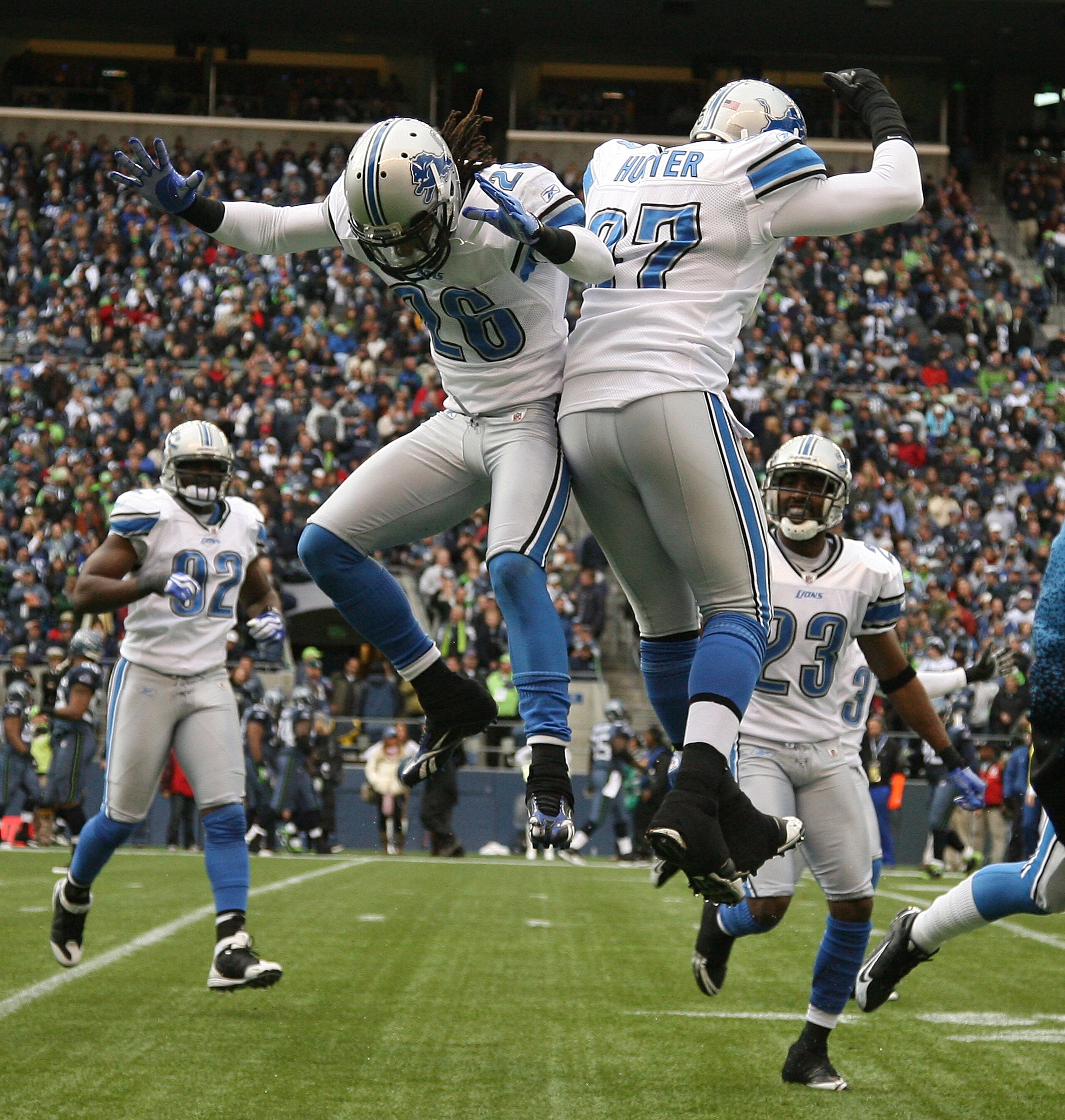 SEATTLE - NOVEMBER 08: Safety Louis Delmas #26 of the Detroit Lions celebrates with Jason Hunter #97 after making an interception against the Seattle Seahawks on November 8, 2009 at Qwest Field in Seattle, Washington. (Photo by Otto Greule Jr/Getty Image SEATTLE - NOVEMBER 08: Safety Louis Delmas #26 of the Detroit Lions celebrates with Jason Hunter #97 after making an interception against the Seattle Seahawks on November 8, 2009 at Qwest Field in Seattle, Washington. (Photo by Otto Greule Jr/Getty Image