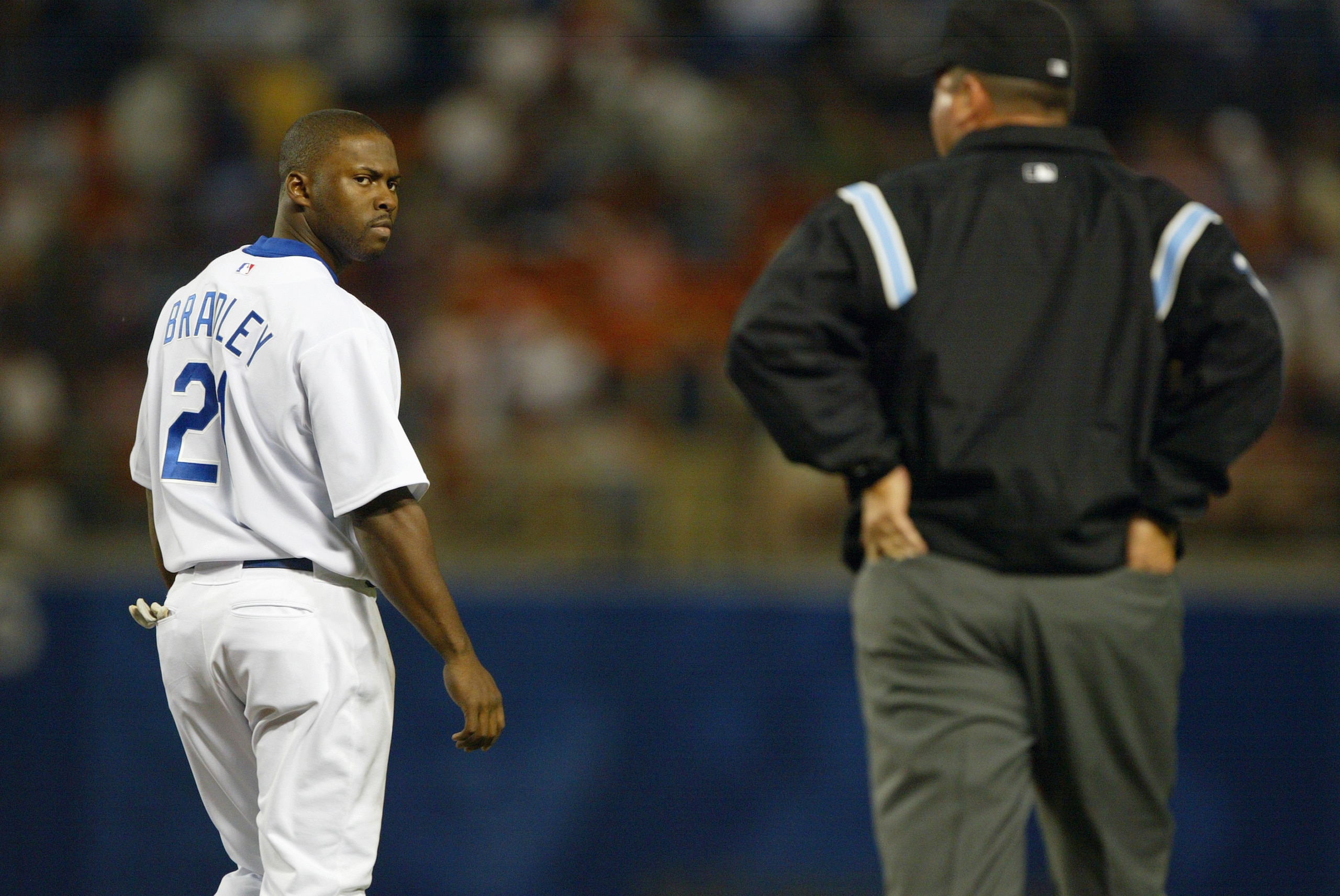 LOS ANGELES - APRIL 23:  Center fielder Milton Bradley #21 of the Los Angeles Dodgers stares at an umpire during the game against the San Francisco Giants on April 23, 2004 at Dodger Stadium in Los Angeles, California. The Dodgers defeated the Giants 5-4.