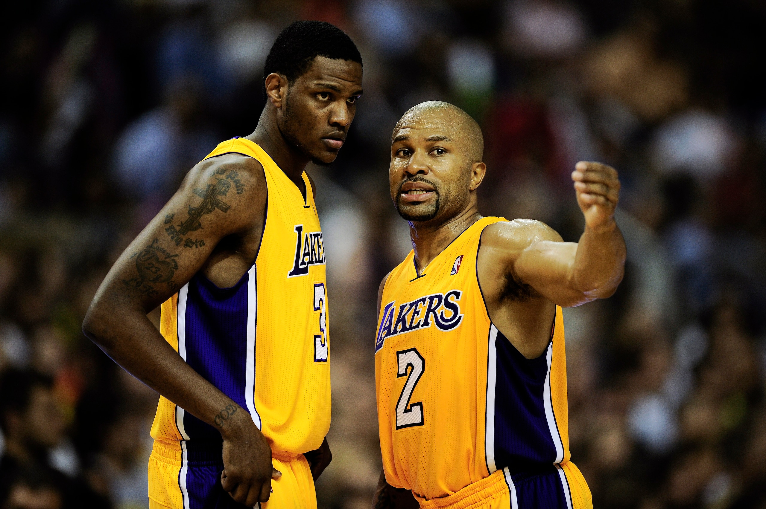BARCELONA, SPAIN - OCTOBER 07:  Devin Ebanks (L) #3 of the Los Angeles Lakers chats with his teammate Derek Fisher #2 during the NBA Europe Live match between Los Angeles Lakers and Regal FC Barcelona at the at Palau Blaugrana on October 7, 2010 in Barcel