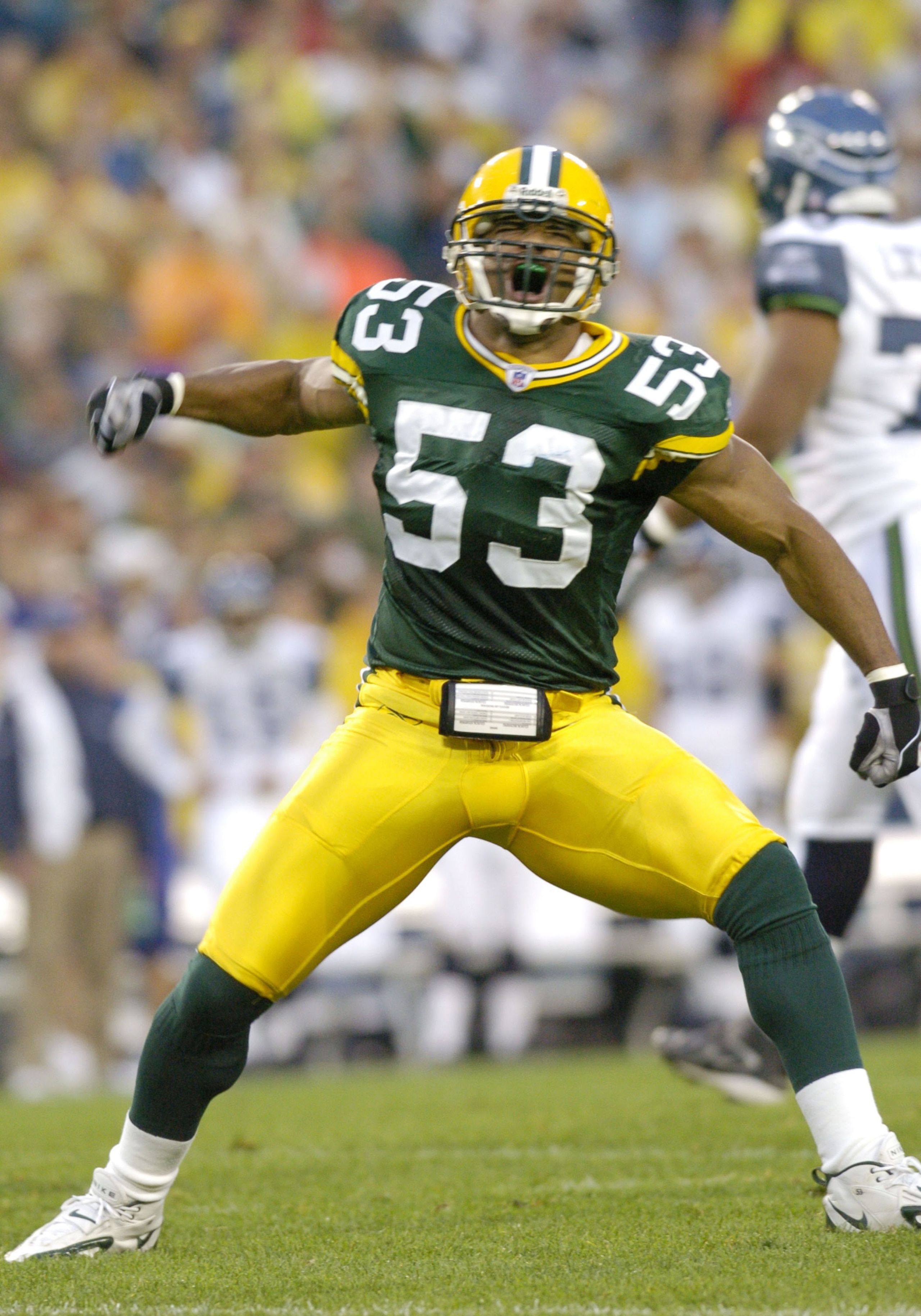 Green Bay Packers linebacker Niko Koutouvides celebrates a special teams tackle    at Lambeau Field against the Seattle Seahawks August 16, 2004.  (Photo by Al Messerschmidt/Getty Images)