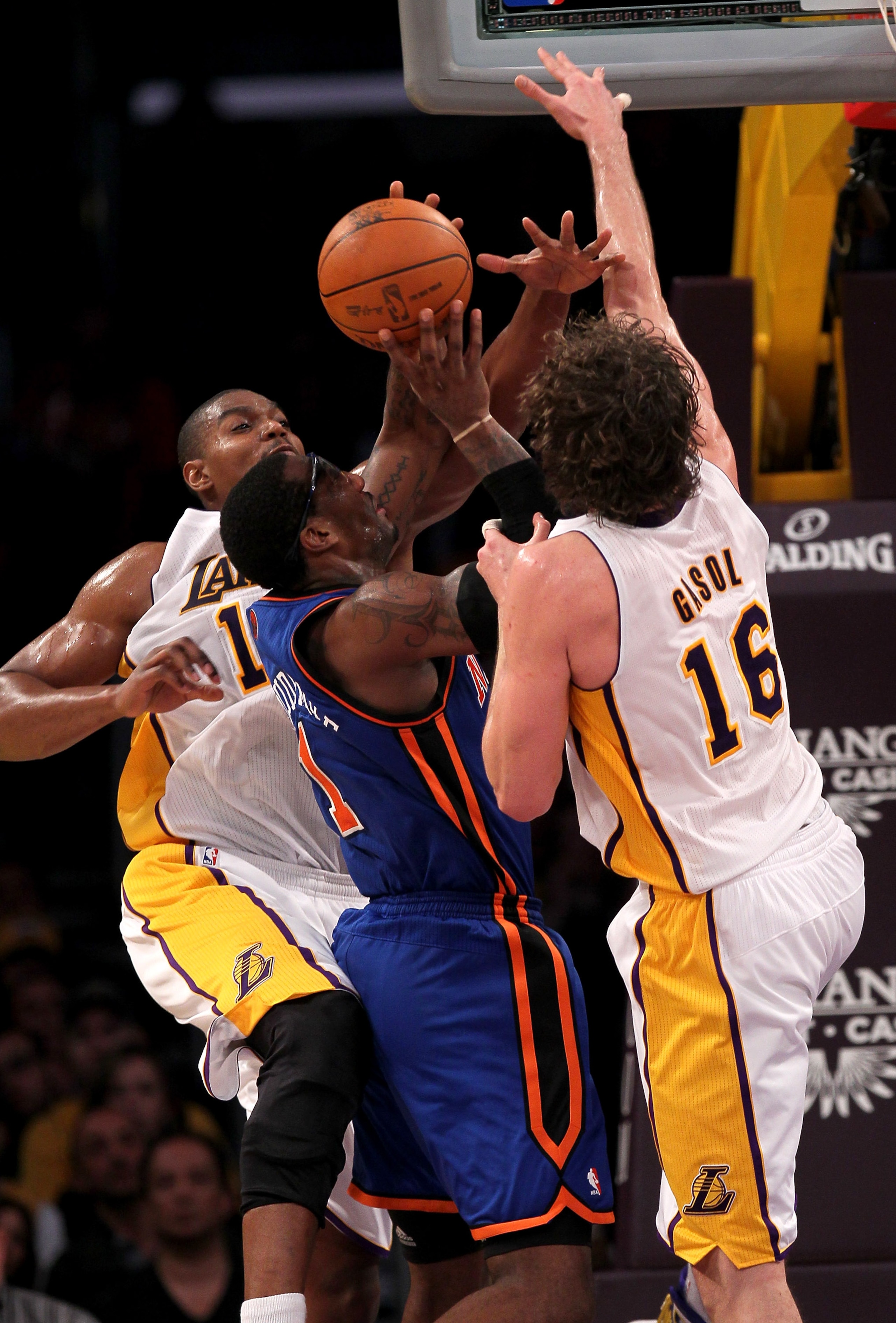 LOS ANGELES, CA - JANUARY 09: Amar'e Stoudemire #1 of the New York Knicks goes up for a shot between Andrew Bynum #17 and Pau Gasol #16 of the Los Angeles Lakers at Staples Center on January 9, 2011 in Los Angeles, California. The Lakers won 109-87. N LOS ANGELES, CA - JANUARY 09: Amar'e Stoudemire #1 of the New York Knicks goes up for a shot between Andrew Bynum #17 and Pau Gasol #16 of the Los Angeles Lakers at Staples Center on January 9, 2011 in Los Angeles, California. The Lakers won 109-87. N