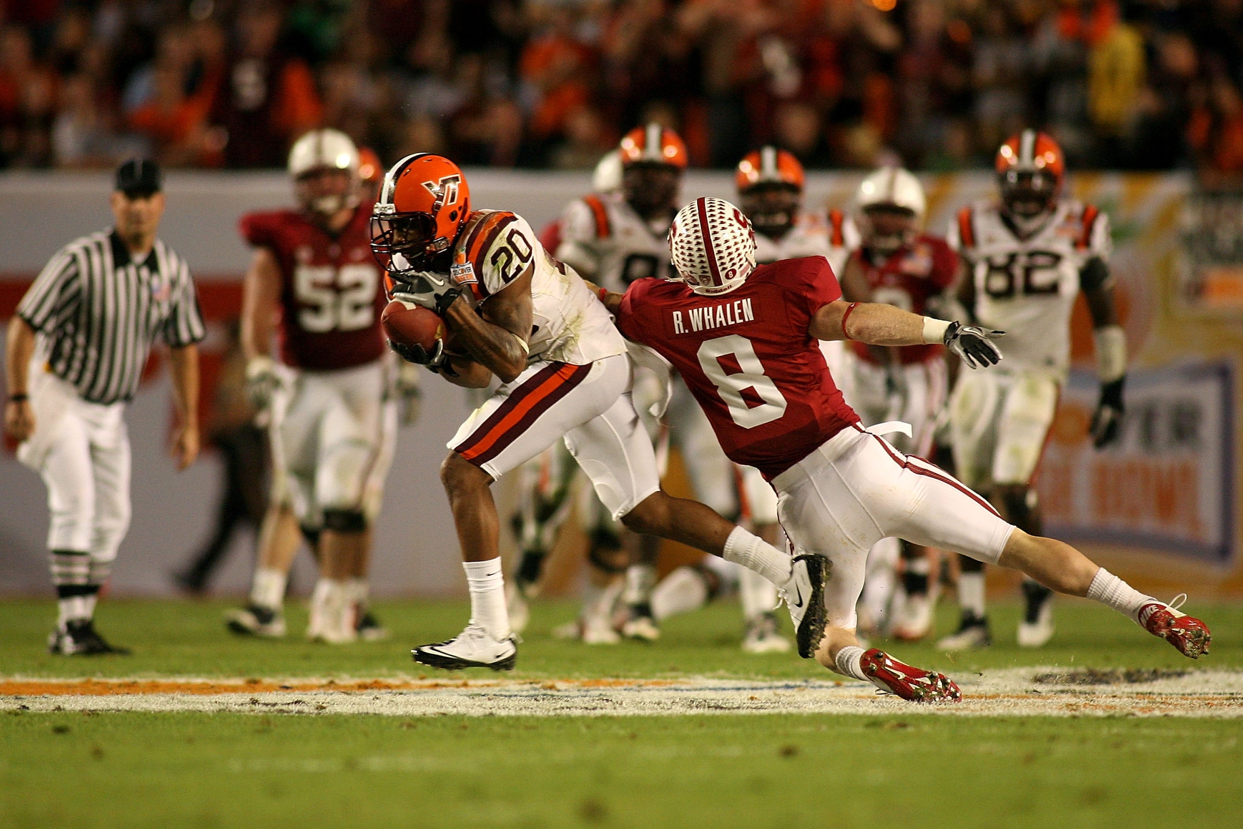 MIAMI, FL - JANUARY 03:  Jayron Hosley #20 of the Virginai Tech Hokies intercepts a pass in the second quarter against Ryan Whalen #8 of the Stanford Cardinal during the 2011 Discover Orange Bowl at Sun Life Stadium on January 3, 2011 in Miami, Florida.