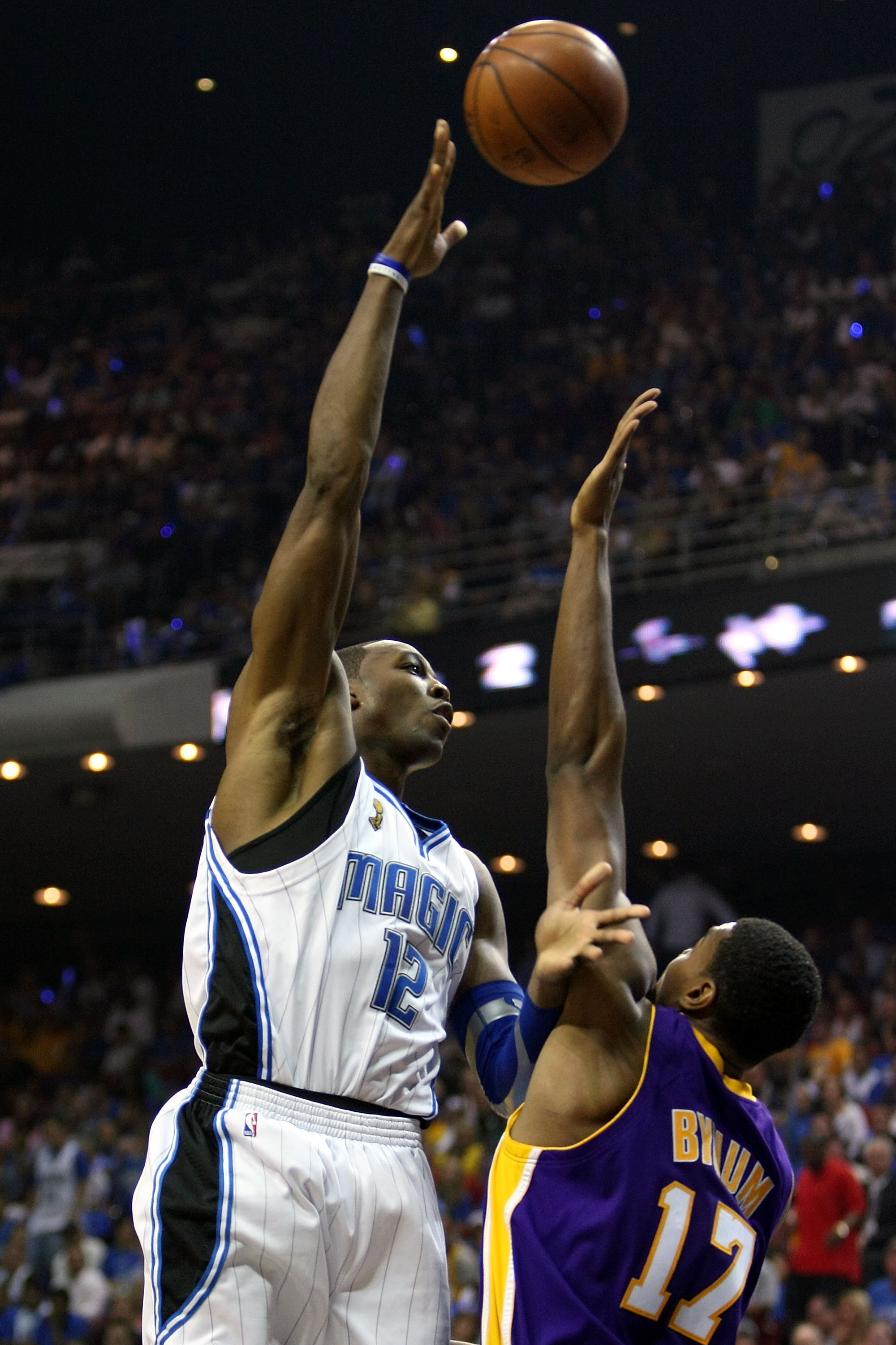 ORLANDO, FL - JUNE 14:  Dwight Howard #12 of the Orlando Magic puts a shot up over Andrew Bynum #17 of the Los Angeles Lakers in Game Five of the 2009 NBA Finals on June 14, 2009 at Amway Arena in Orlando, Florida.  NOTE TO USER:  User expressly acknowled