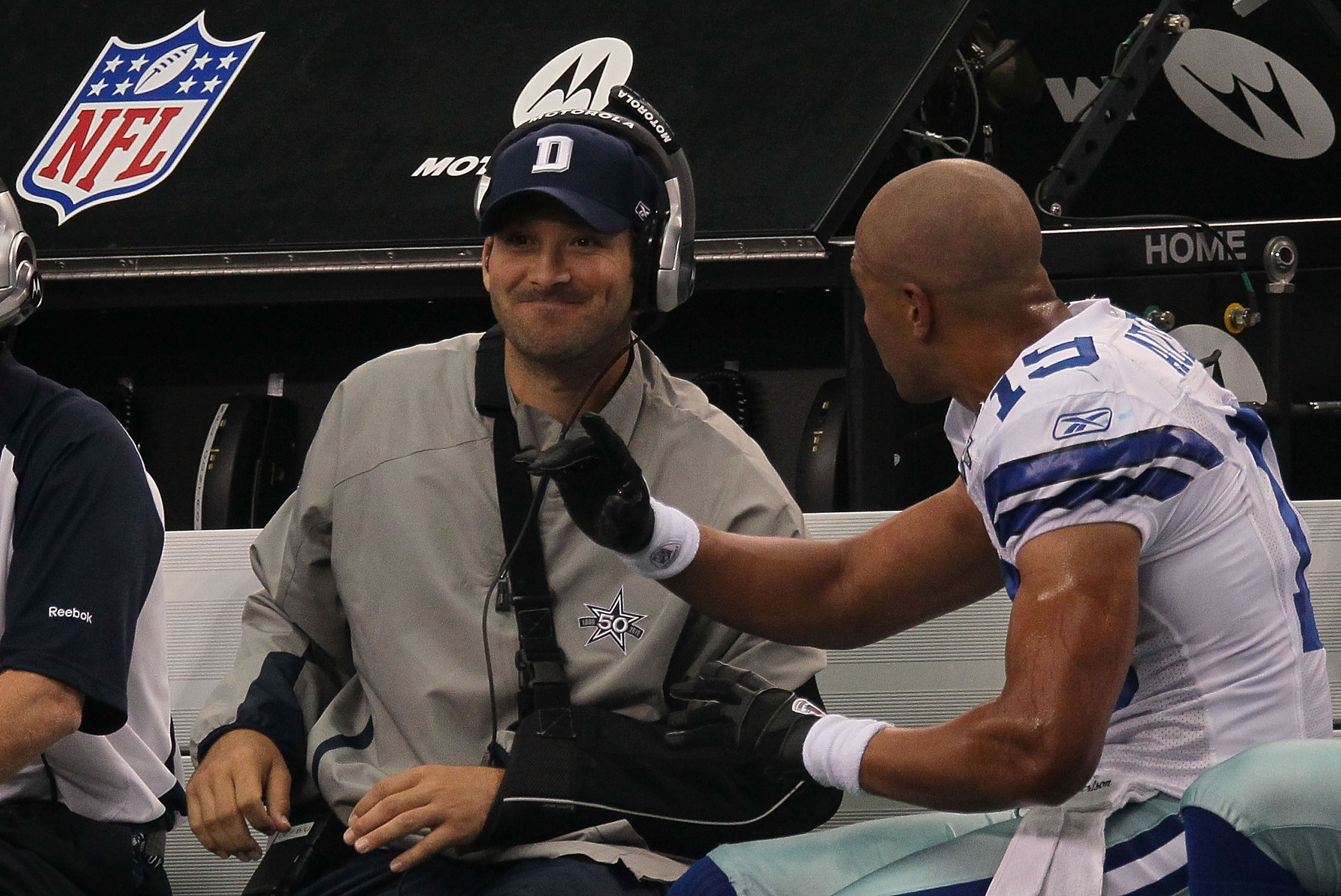 ARLINGTON, TX - OCTOBER 31:  Quarterback Tony Romo #9 talks with Miles Austin #19 of the Dallas Cowboys on the sidelines during a game against the Jacksonville Jaguars at Cowboys Stadium on October 31, 2010 in Arlington, Texas.  (Photo by Stephen Dunn/Get