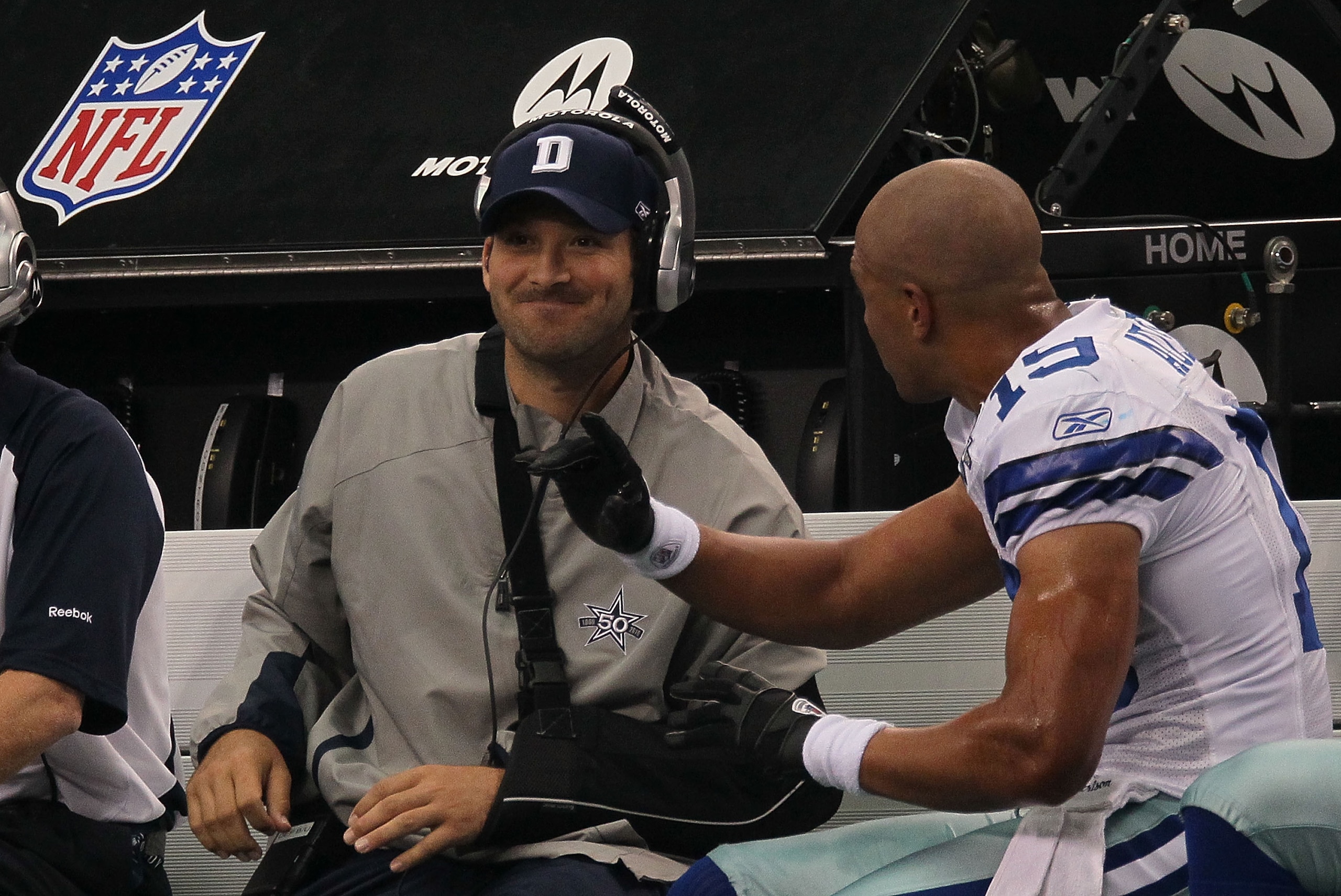 ARLINGTON, TX - OCTOBER 31:  Quarterback Tony Romo #9 talks with Miles Austin #19 of the Dallas Cowboys on the sidelines during a game against the Jacksonville Jaguars at Cowboys Stadium on October 31, 2010 in Arlington, Texas.  (Photo by Stephen Dunn/Get