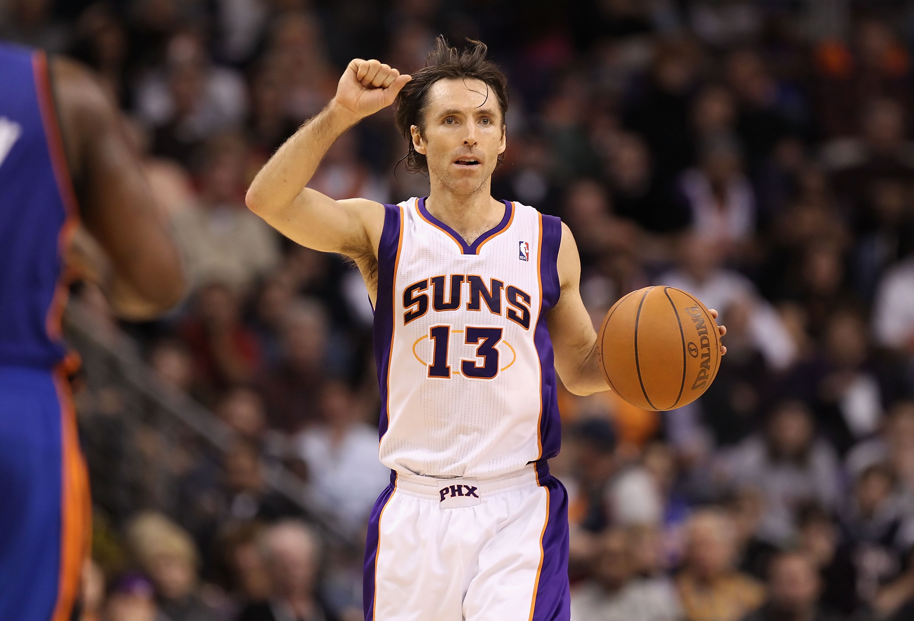 PHOENIX, AZ - JANUARY 07:  Steve Nash #13 of the Phoenix Suns handles the ball during the NBA game against the New York Knicks at US Airways Center on January 7, 2011 in Phoenix, Arizona.  The Knicks defeated the Suns 121-96.  NOTE TO USER: User expressly